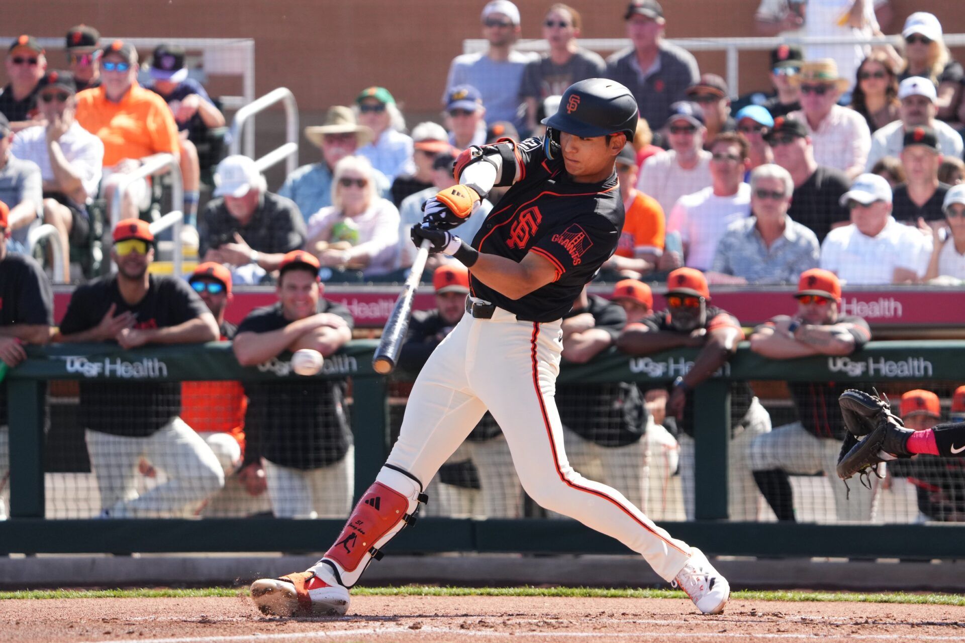 San Francisco Giants outfielder Jung Hoo Lee (51) bats against the Los Angeles Angels during the first inning at Scottsdale Stadium.