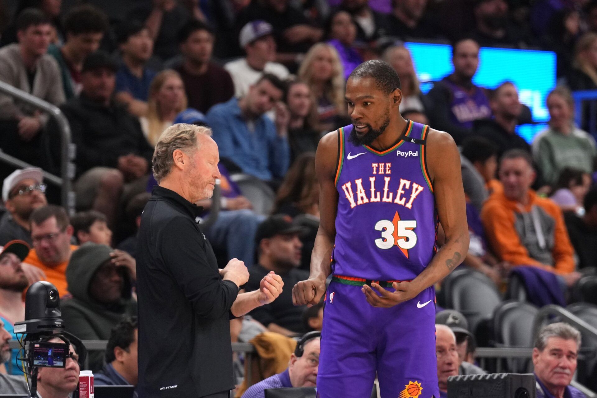 Phoenix Suns head coach Mike Budenholzer talks with Phoenix Suns forward Kevin Durant (35) against the LA Clippers during the second half at PHX Center.