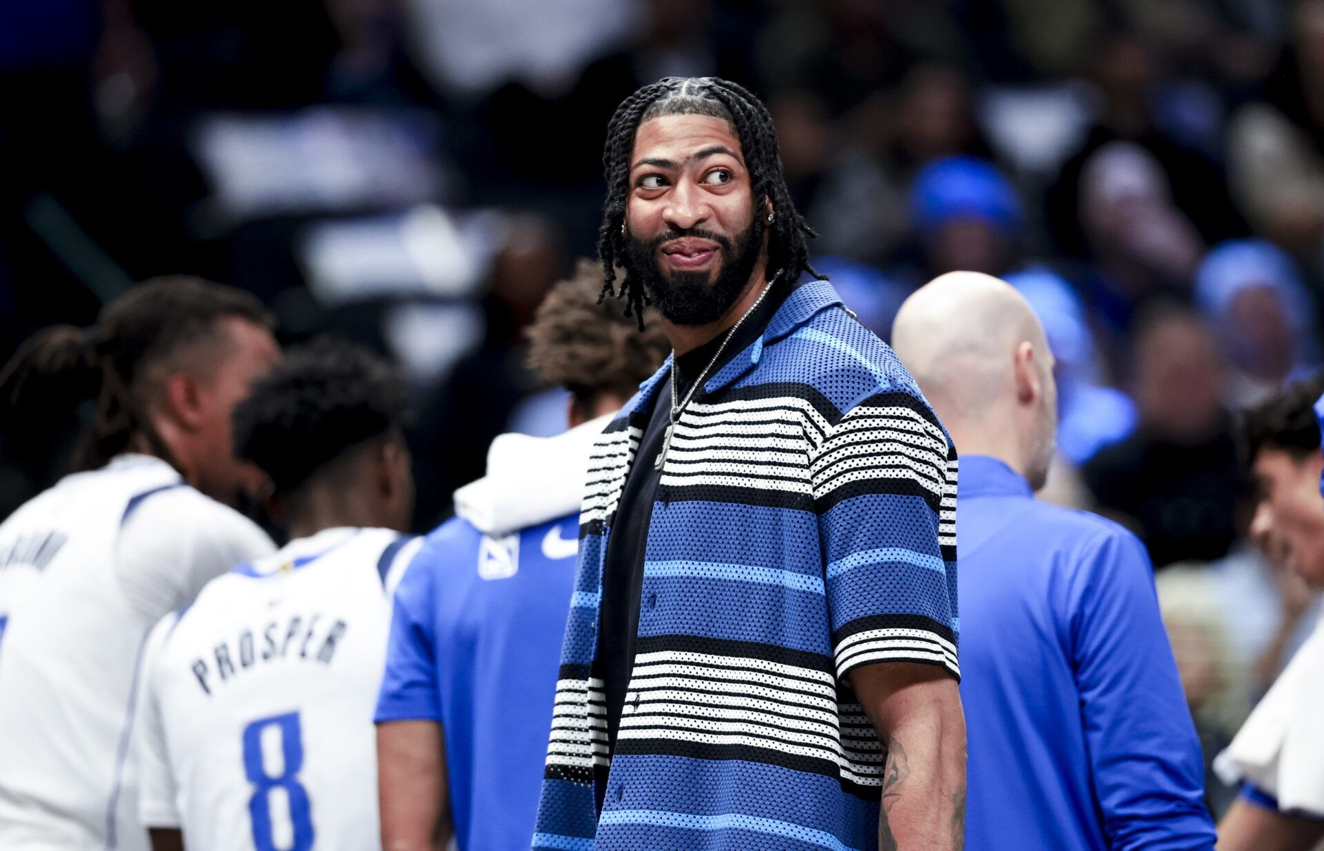 Dallas Mavericks forward Anthony Davis laughs during a timeout against the Charlotte Hornets during the first half at American Airlines Center.