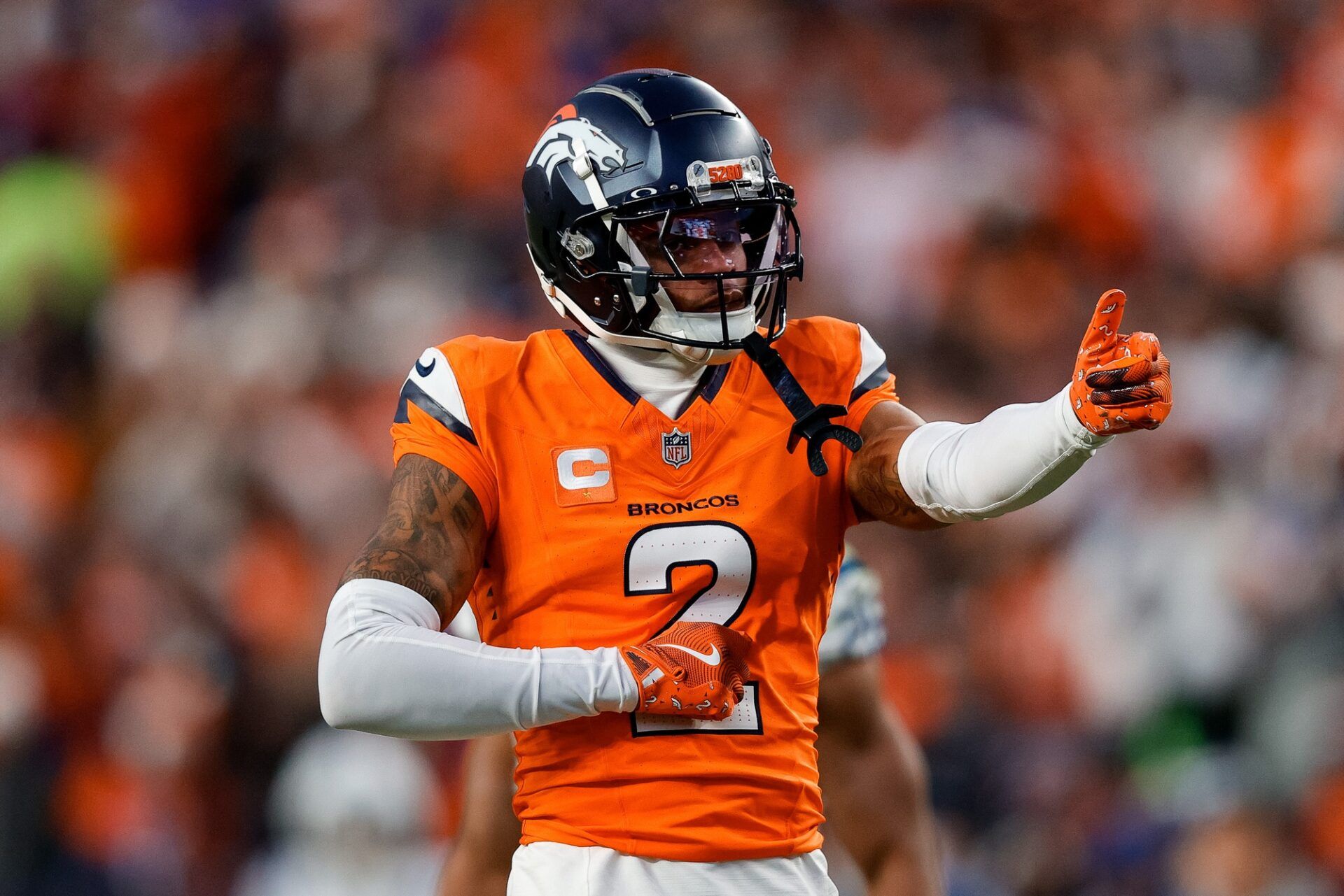 Denver Broncos cornerback Pat Surtain II (2) gestures after a play in the third quarter against the Indianapolis Colts at Empower Field at Mile High.