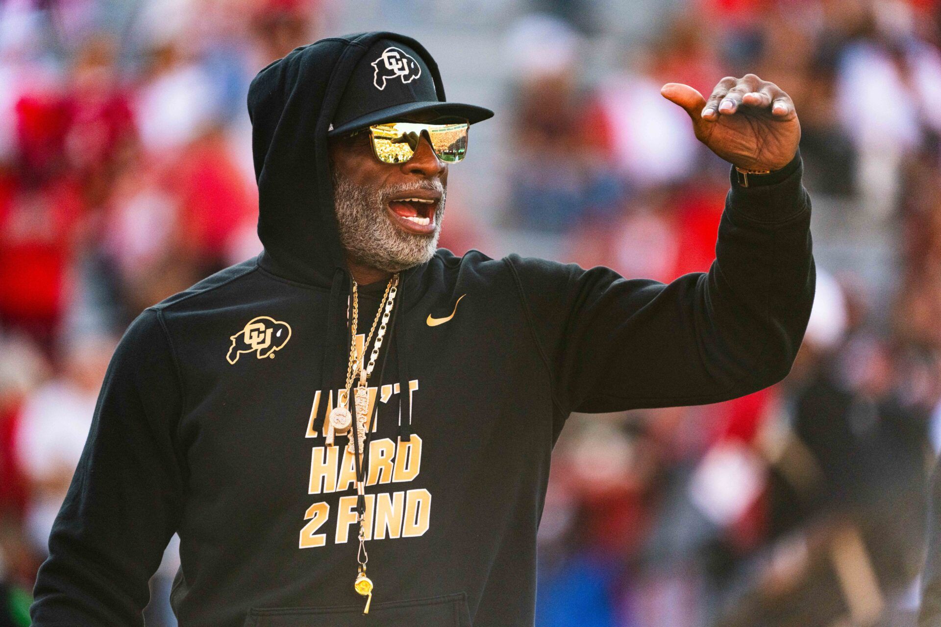 Sep 7, 2024; Lincoln, Nebraska, USA; Colorado Buffaloes head coach Deion Sanders watches warmups before the game against the Nebraska Cornhuskers at Memorial Stadium. Mandatory Credit: Dylan Widger-Imagn Images