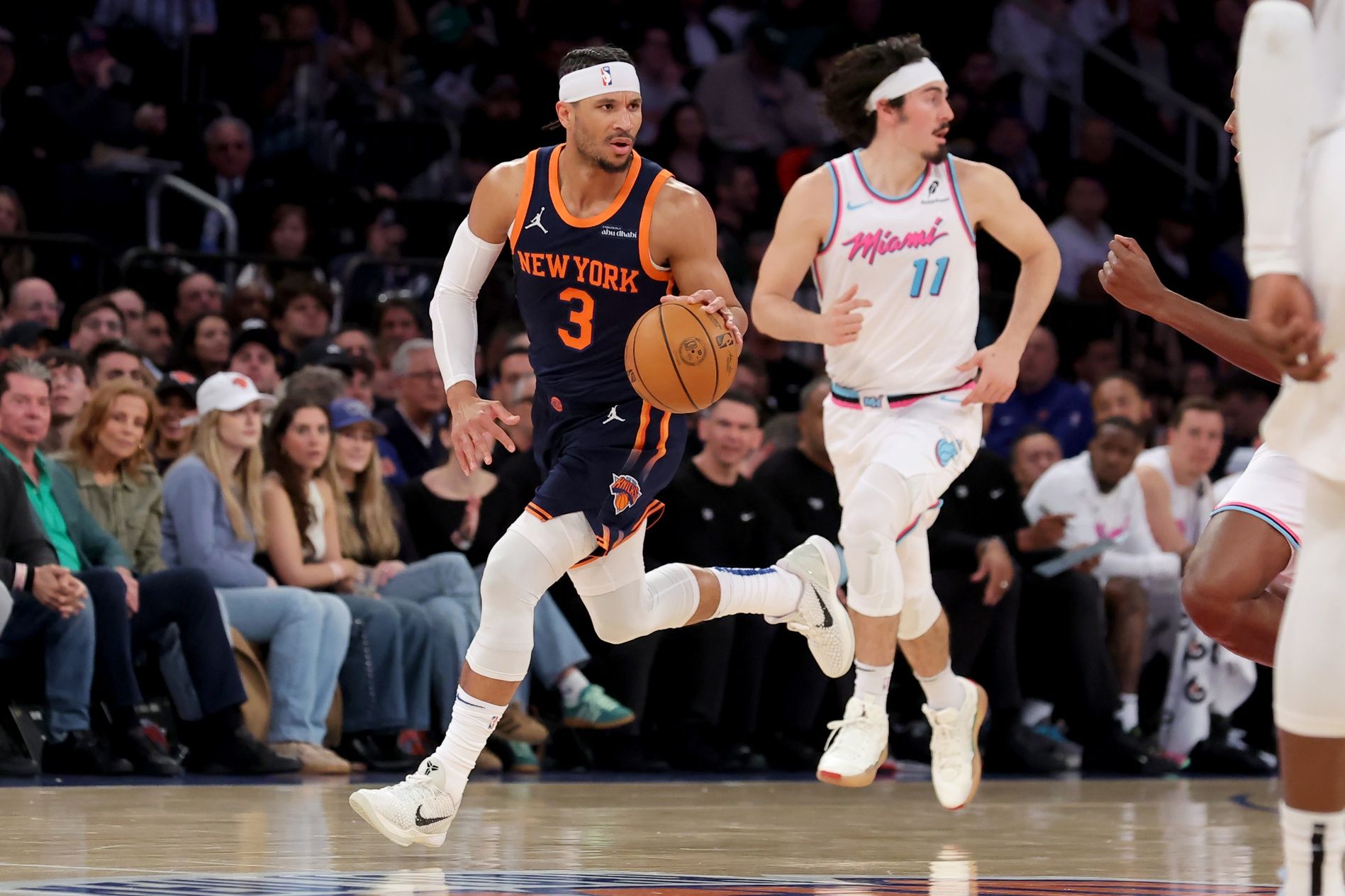 New York Knicks guard Josh Hart (3) brings the ball up court against Miami Heat guard Jaime Jaquez Jr. (11) during the second quarter at Madison Square Garden.