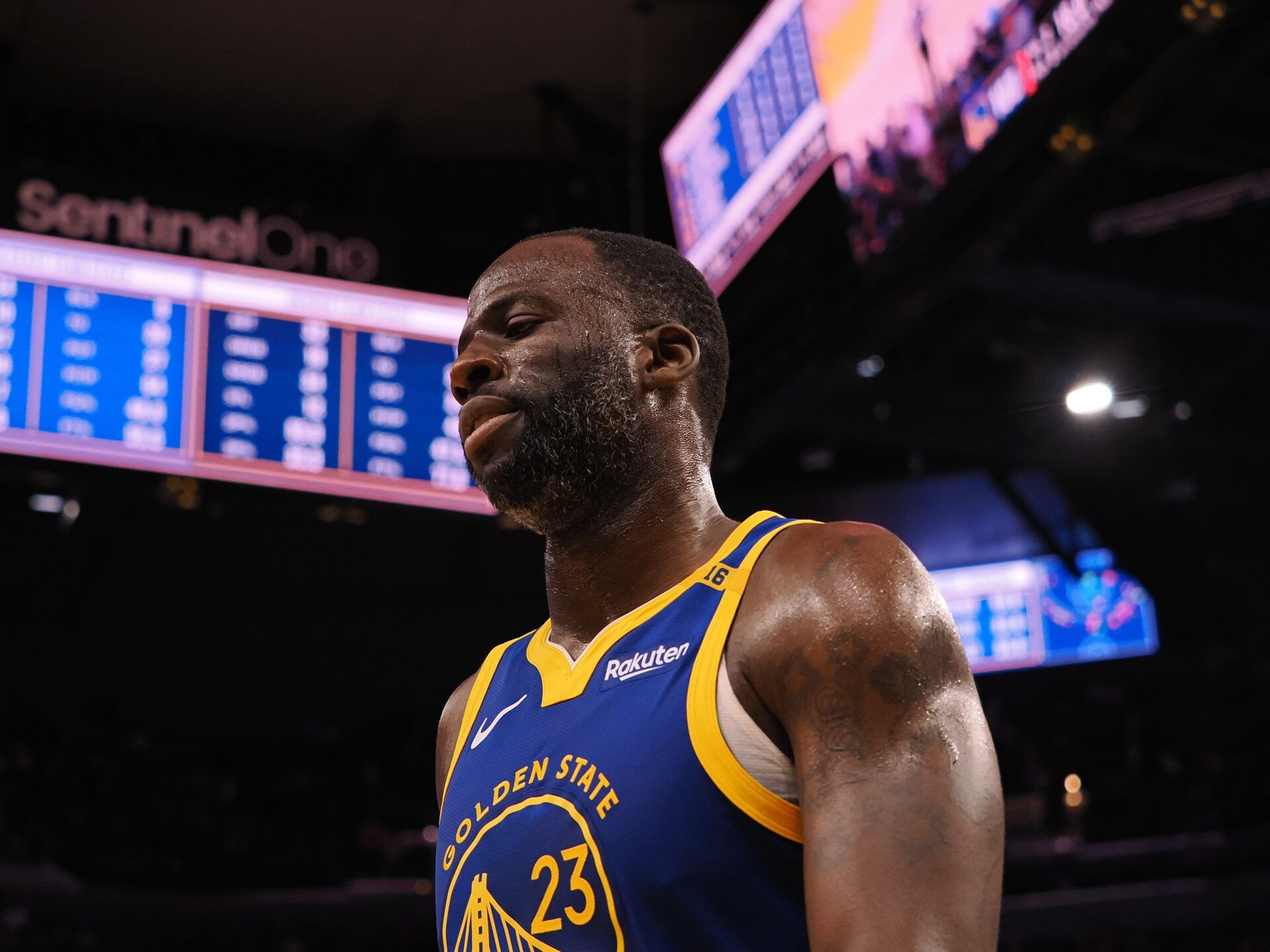 Golden State Warriors forward Draymond Green (23) walks off the court with time remaining during the final seconds of the fourth quarter against the Denver Nuggets at Chase Center.