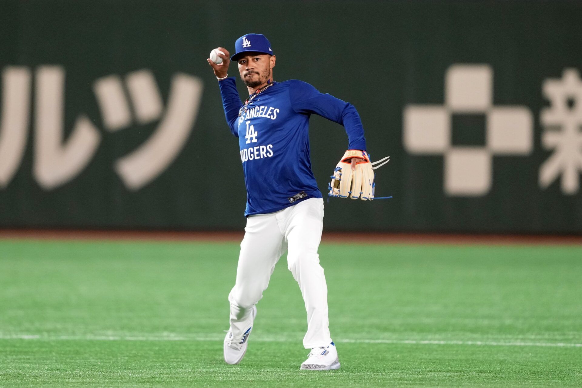 Los Angeles Dodgers shortstop Mookie Betts (50) warms up before the game against the Yomiuri Giants at Tokyo Dome.