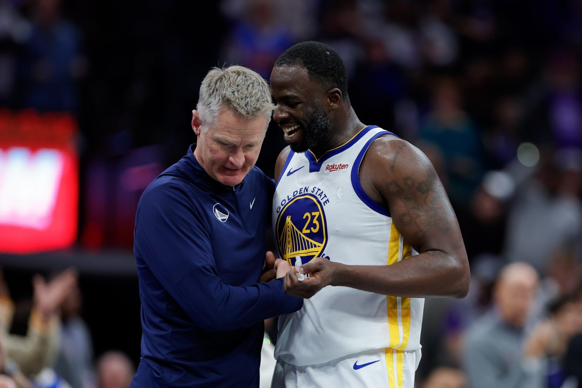 Golden State Warriors forward Draymond Green (23) talks with head coach Steve Kerr during the fourth quarter against the Sacramento Kings at Golden 1 Center.