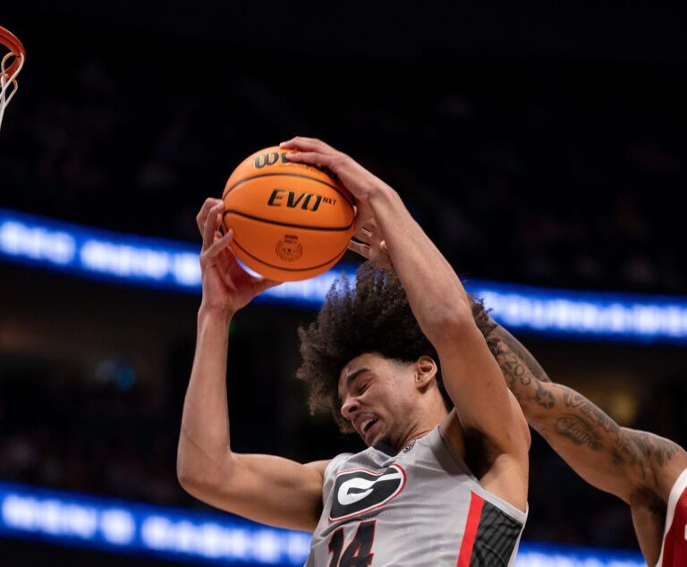 Georgia Bulldogs forward Asa Newell (14) hauls in a rebound against the Oklahoma Sooners during their first round game of the SEC Men's Basketball Tournament at Bridgestone Arena in Nashville, Tenn., Wednesday, March 12, 2025.
