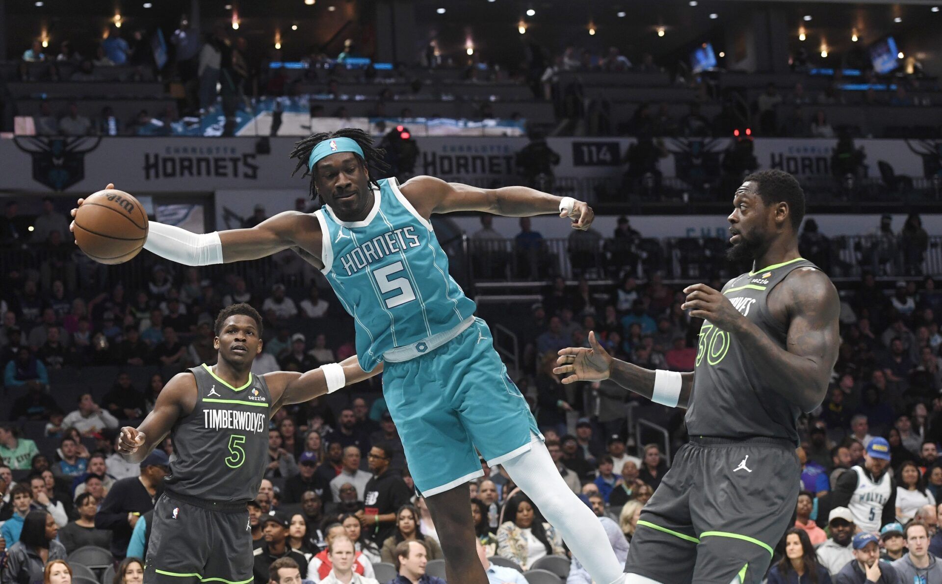 Charlotte Hornets center Mark Williams (5) keeps the ball inbounds during the first half against the Minnesota Timberwolves at the Spectrum Center.