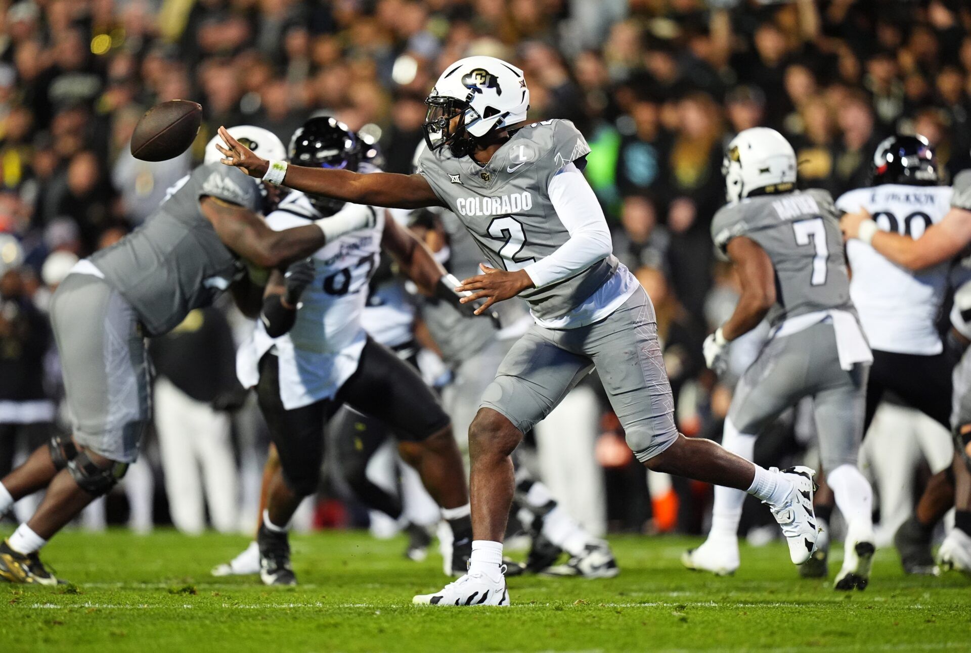 Colorado Buffaloes quarterback Shedeur Sanders (2) pitches the ball in the second quarter against the Cincinnati Bearcats at Folsom Field.