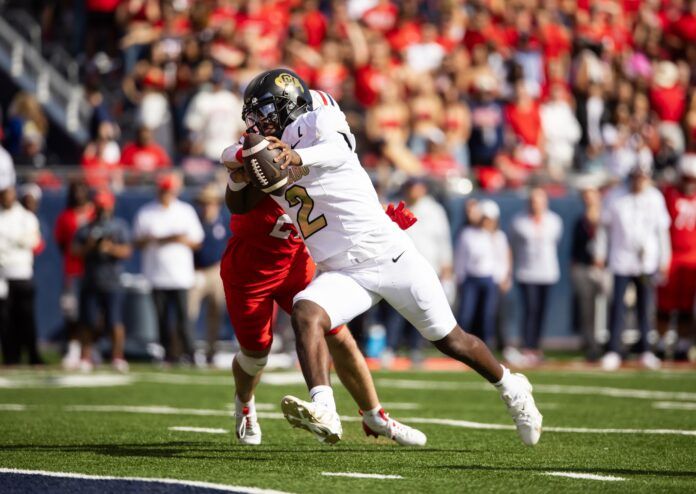 Colorado Buffalos quarterback Shedeur Sanders (2) runs for a touchdown against the Arizona Wildcats in the first half at Arizona Stadium.