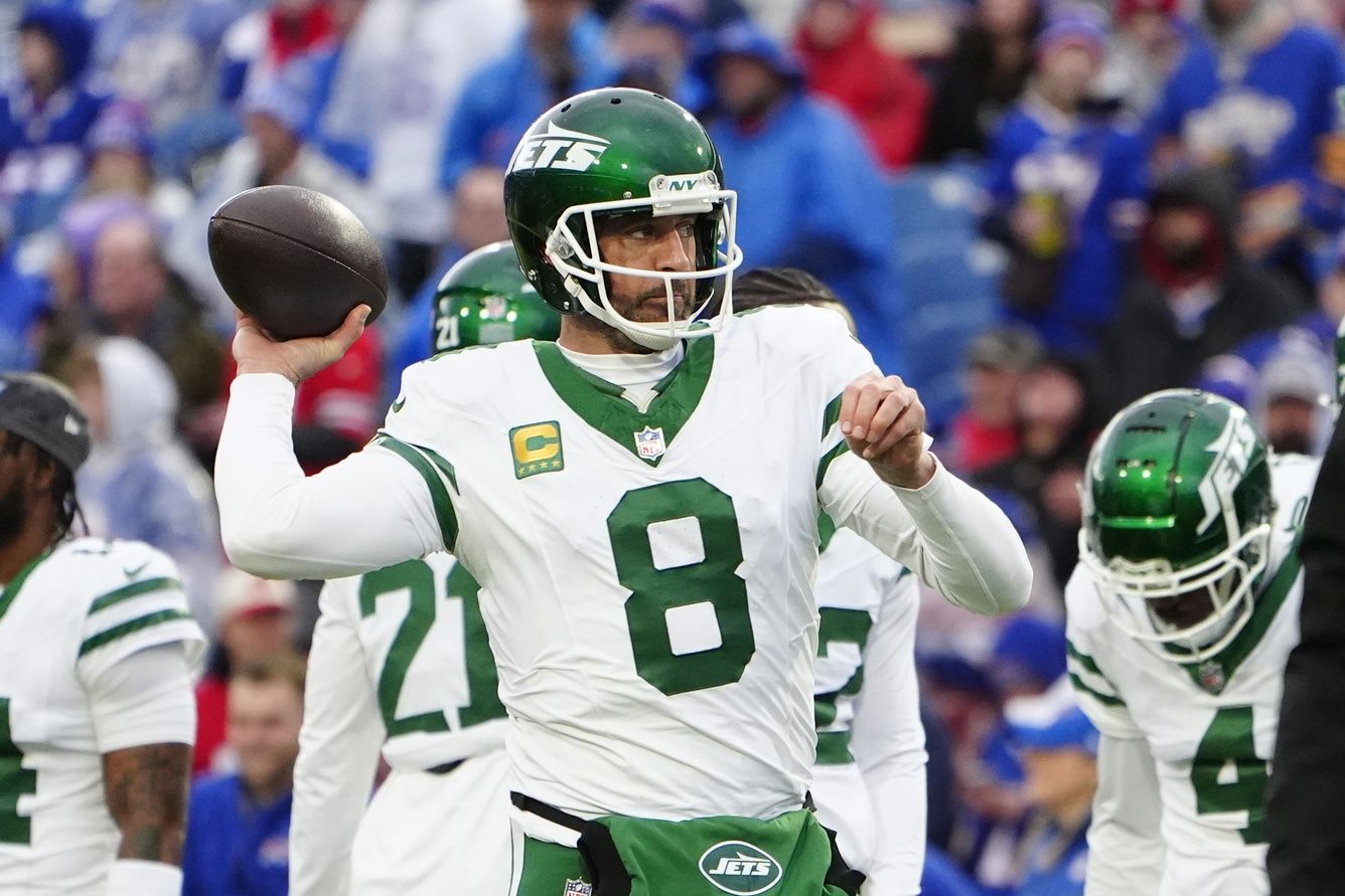 New York Jets quarterback Aaron Rodgers (8) warms up prior to the game against the Buffalo Bills at Highmark Stadium.