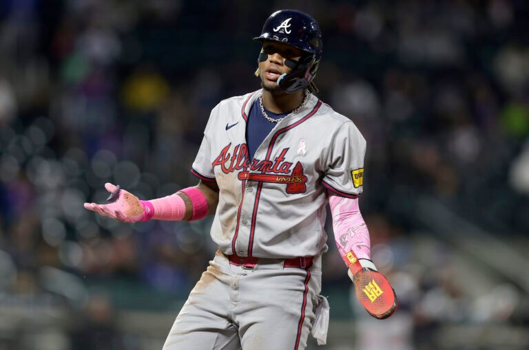 NEW YORK, NEW YORK - MAY 12: Ronald Acuna Jr. #13 of the Atlanta Braves reacts after he was picked off at first base during the fifth inning against the New York Mets at Citi Field on May 12, 2024 in New York City. (Photo by Jim McIsaac/Getty Images)