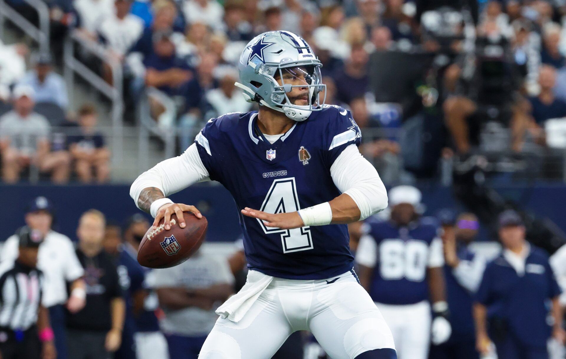 Dallas Cowboys quarterback Dak Prescott (4) throws during the first quarter against the Detroit Lions at AT&T Stadium.