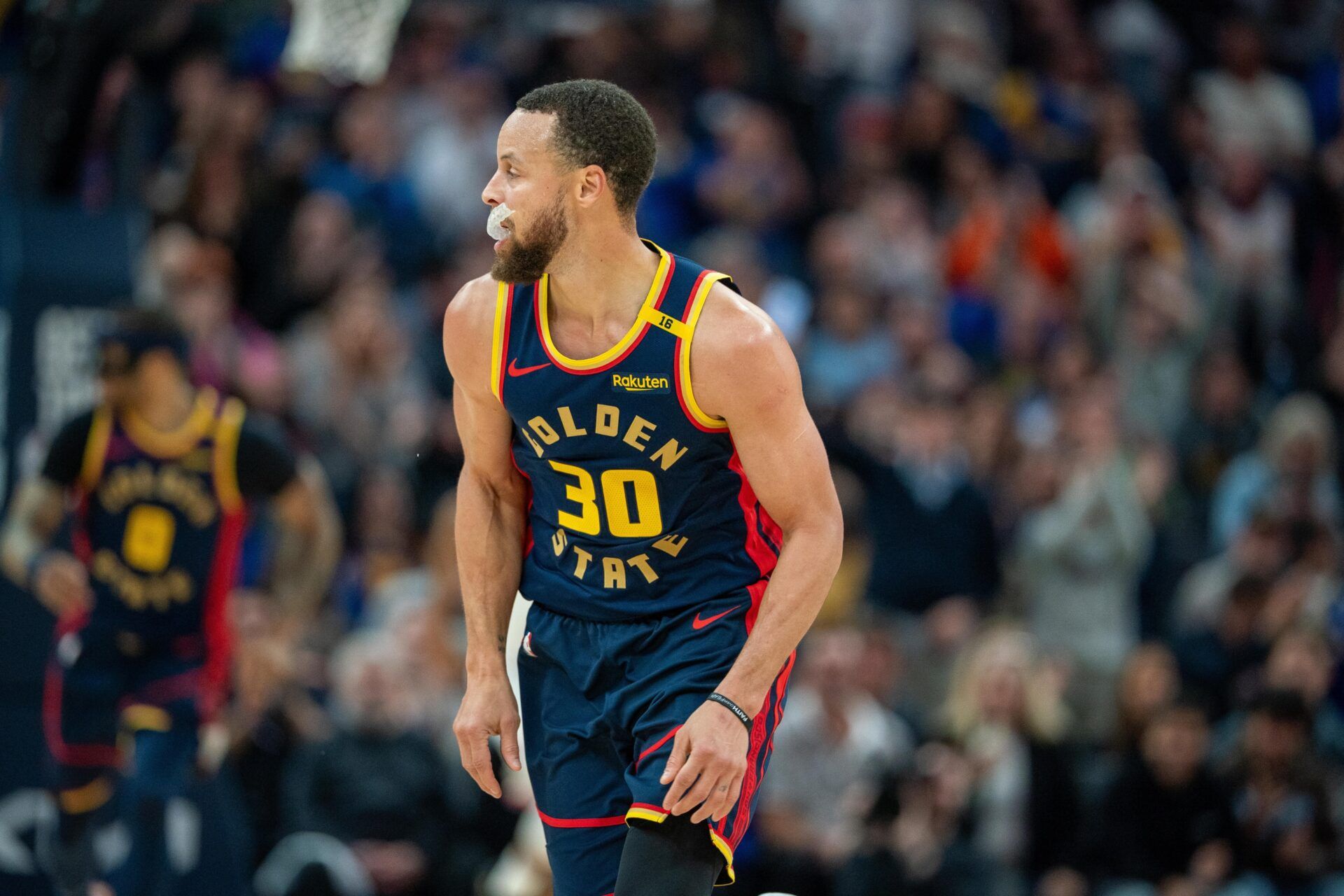 Golden State Warriors guard Stephen Curry (30) celebrates after the three point basket against the New York Knicks during the second quarter at Chase Center.