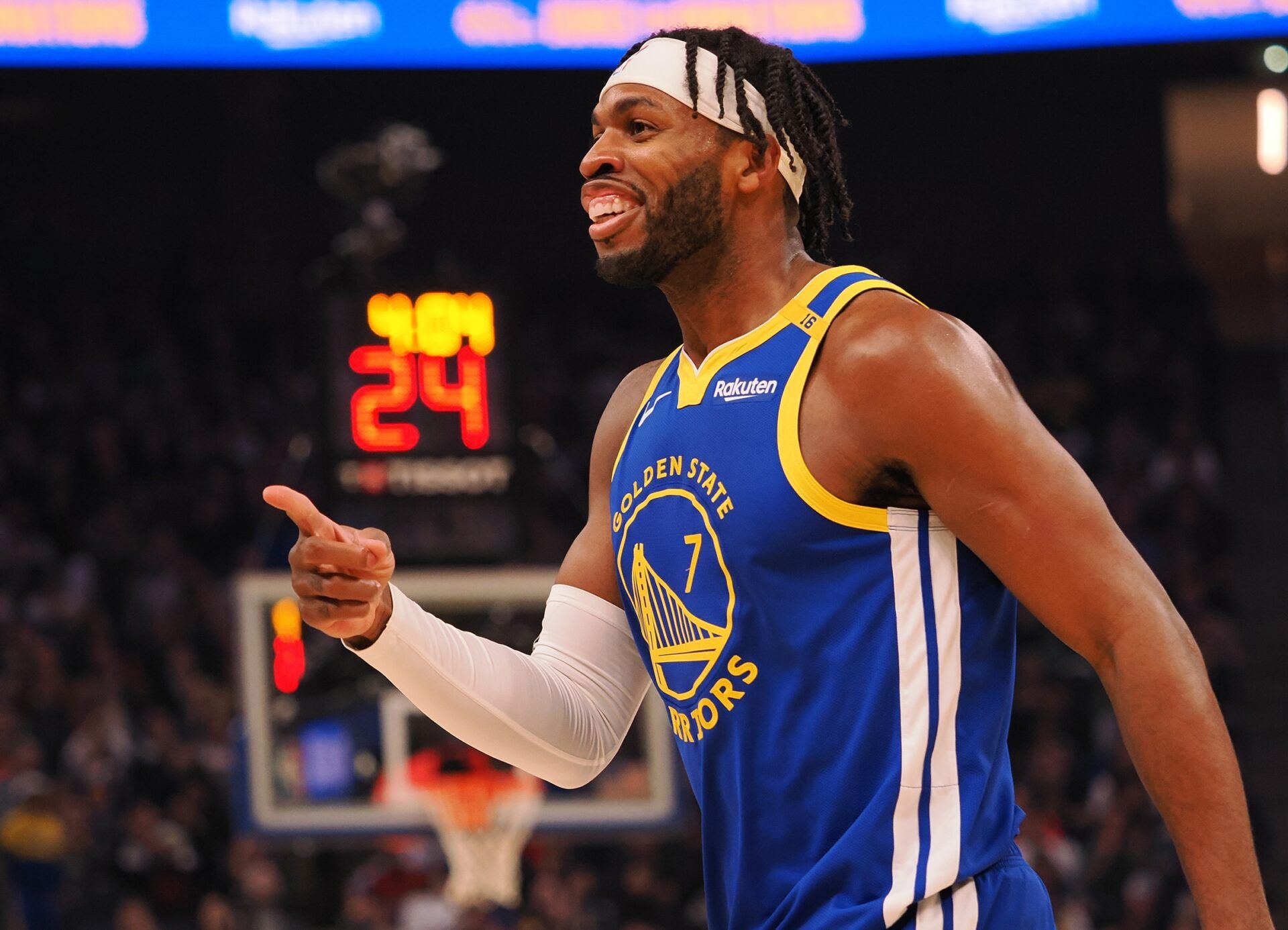 Golden State Warriors guard Buddy Hield (7) smiles after a basket as a time out is called during the first quarter against the Denver Nuggets at Chase Center.