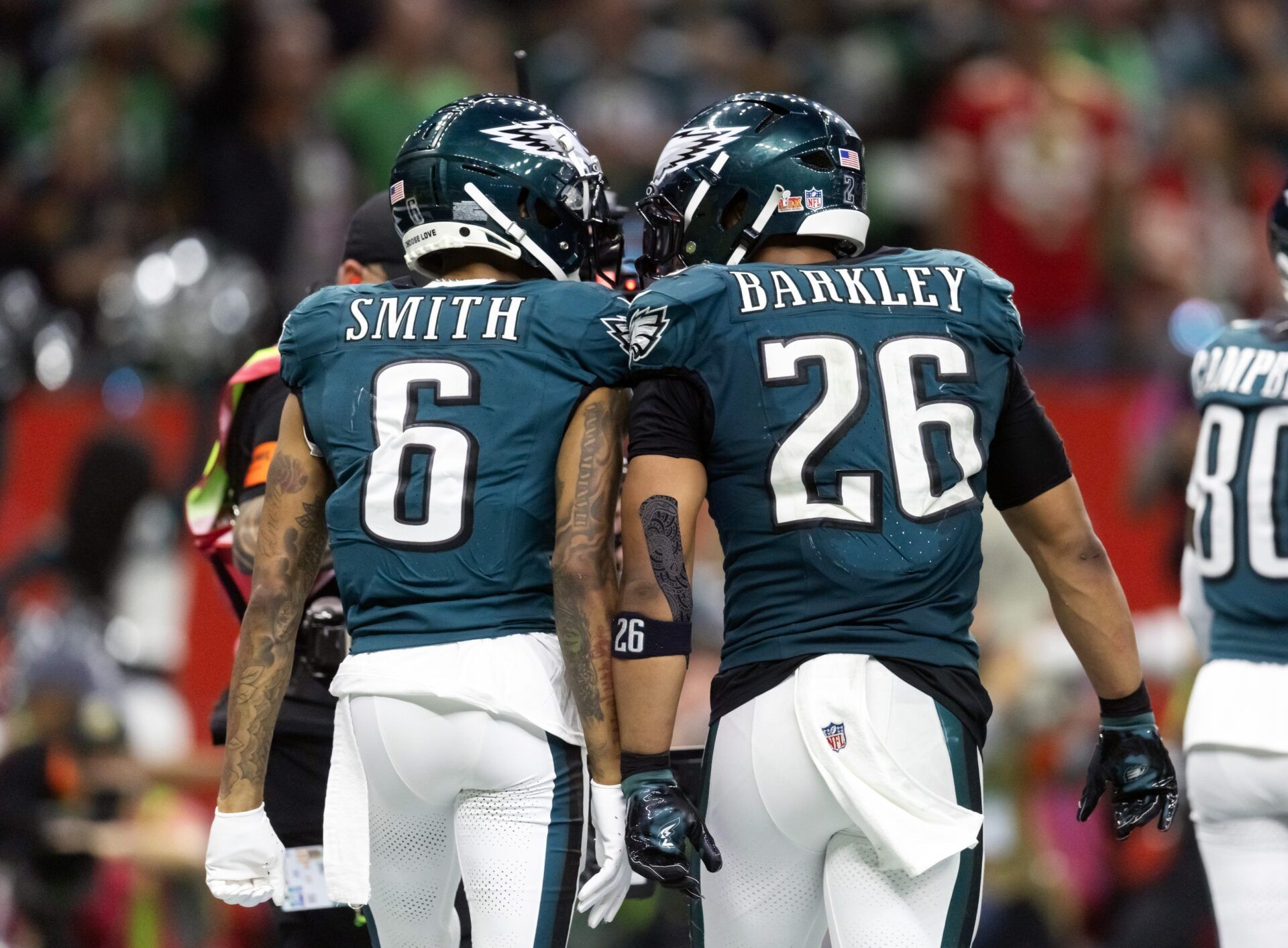 Philadelphia Eagles wide receiver DeVonta Smith (6) celebrates a touchdown with running back Saquon Barkley (26) against the Kansas City Chiefs during Super Bowl LIX at Ceasars Superdome.