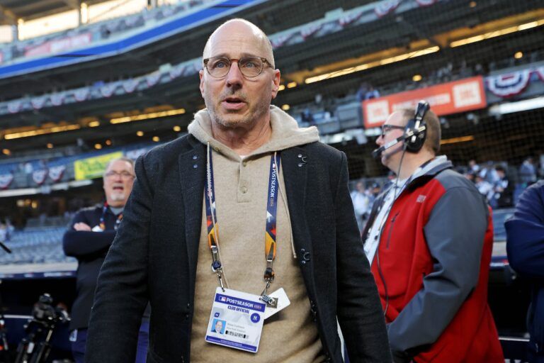 New York Yankees general manager Brian Cashman walks on the field before game three of the 2024 MLB World Series between the New York Yankees and the Los Angeles Dodgers at Yankee Stadium.