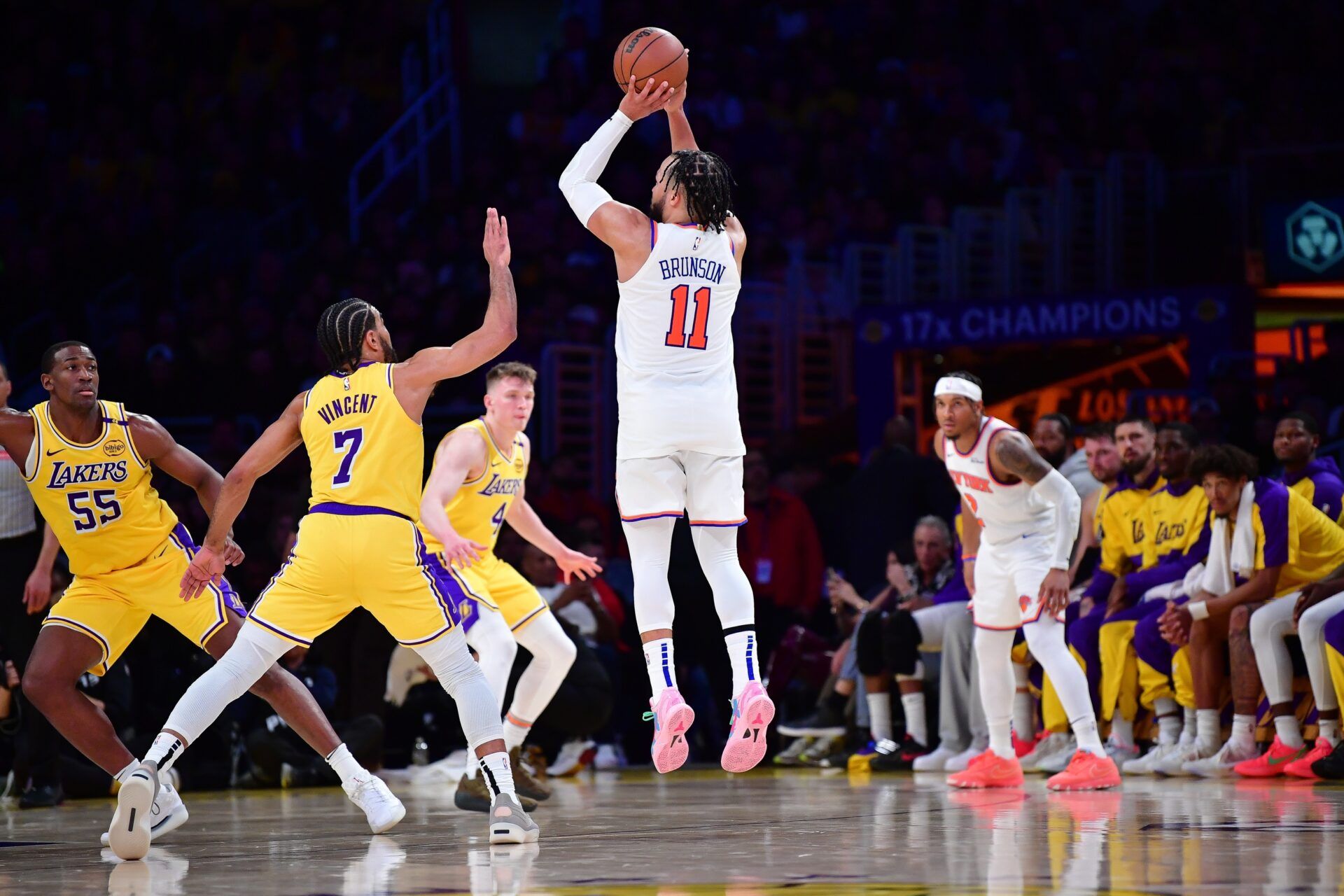 New York Knicks guard Jalen Brunson (11) shoots against Los Angeles Lakers guard Gabe Vincent (7) during the second half at Crypto.com Arena.