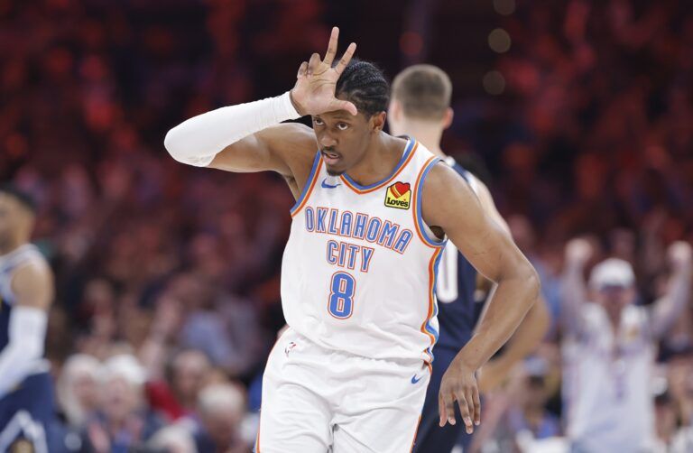 Oklahoma City Thunder forward Jalen Williams (8) gestures after scoring a three point basket against the Denver Nuggets during the second quarter at Paycom Center.