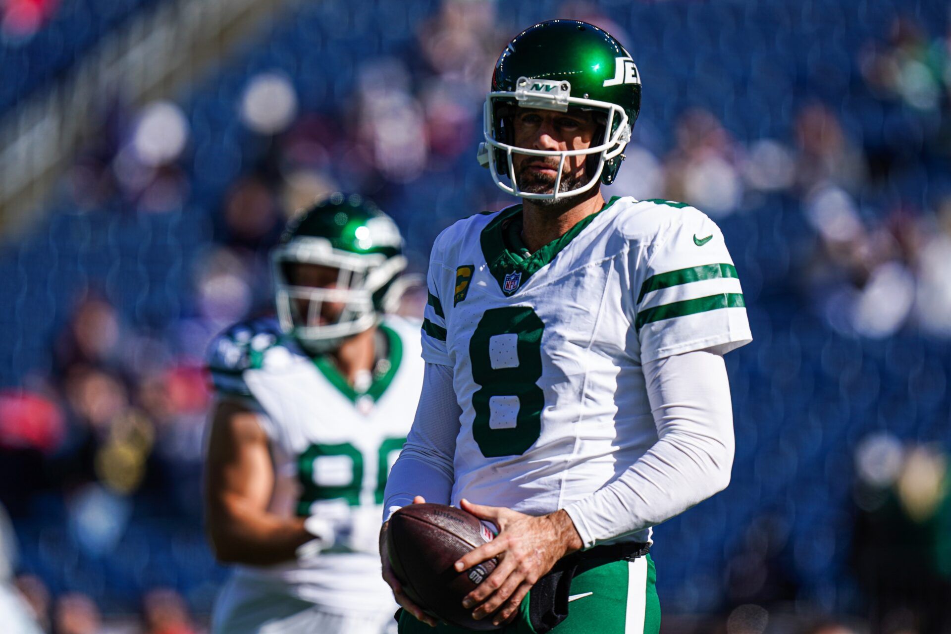 New York Jets quarterback Aaron Rodgers (8) warms up before the start of the game against the New England Patriots at Gillette Stadium.