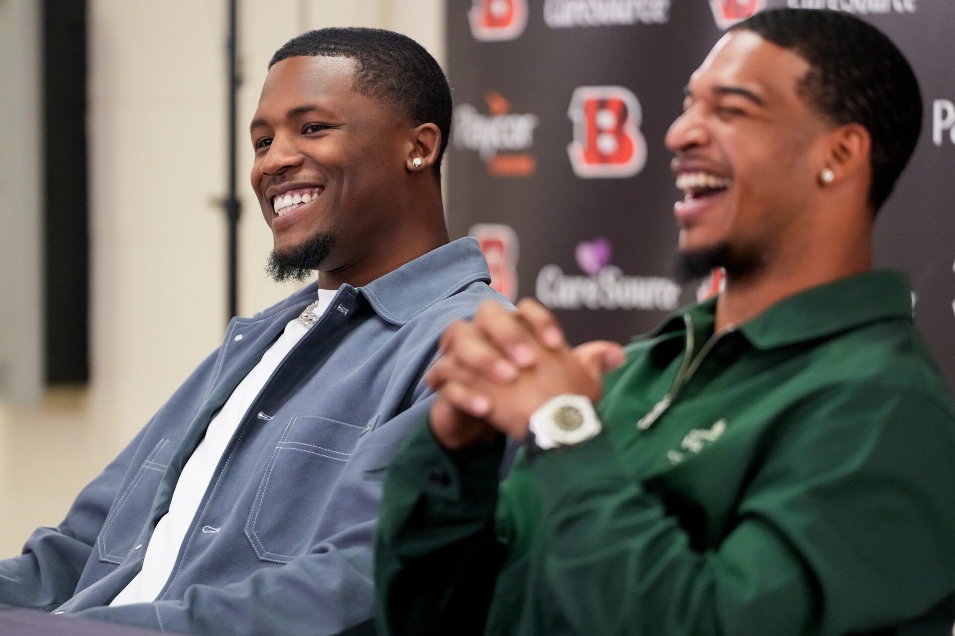 Cincinnati Bengals receivers Tee Higgins (left) and Ja’marr Chase take the stage during a press conference to announce the signing of new contracts for the pair at Paycor Stadium in downtown Cincinnati on Tuesday, March 18, 2025. Chase becomes the new highest-paid non-quarterback player in the NFL.