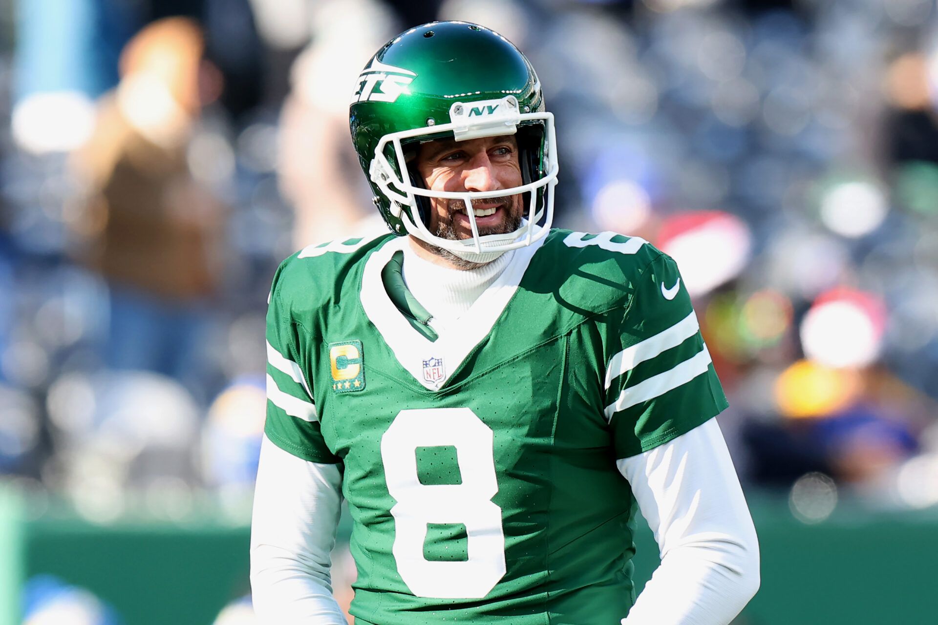 EAST RUTHERFORD, NEW JERSEY - DECEMBER 22: Aaron Rodgers #8 of the New York Jets smiles before a game against the Los Angeles Rams at MetLife Stadium on December 22, 2024 in East Rutherford, New Jersey. (Photo by Emilee Chinn/Getty Images)