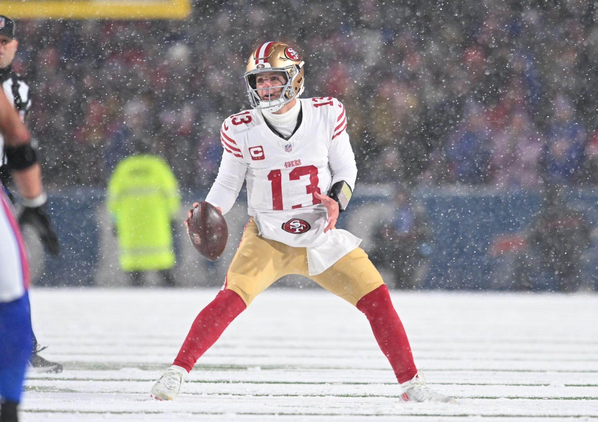 San Francisco 49ers quarterback Brock Purdy (13) moves out of the pocket to throw a pass against the Buffalo Bills in the second quarter at Highmark Stadium.