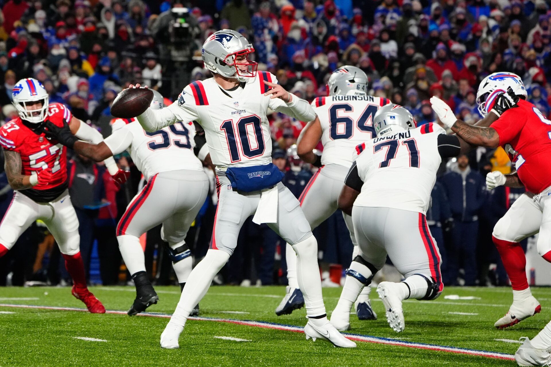 New England Patriots quarterack Drake Maye (10) throws the ball against the Buffalo Bills during the first half at Highmark Stadium.