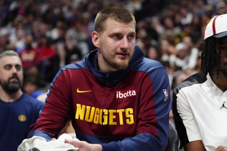 Denver Nuggets center Nikola Jokic (15) on the bench in the second half against the Utah Jazz at Ball Arena.
