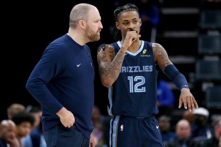 Memphis Grizzlies head coach Taylor Jenkins talks with guard Ja Morant (12) during the fourth quarter against the Oklahoma City Thunder at FedExForum.
