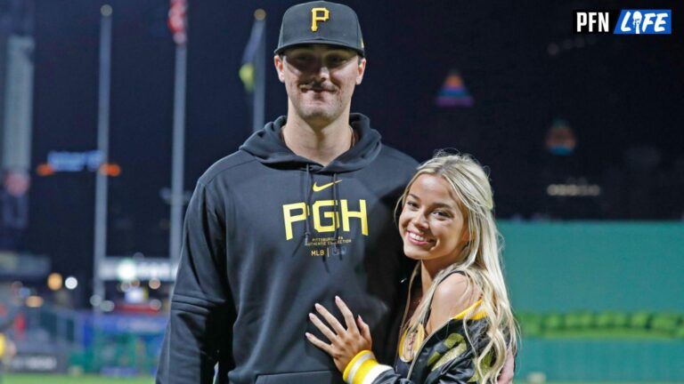 Pittsburgh Pirates starting pitcher Paul Skenes (30) poses with his girlfriend Louisiana State University gymnast Olivia Dunn (right) after making his major league debut against the Chicago Cubs at PNC Park. The Pirates won 10-8.