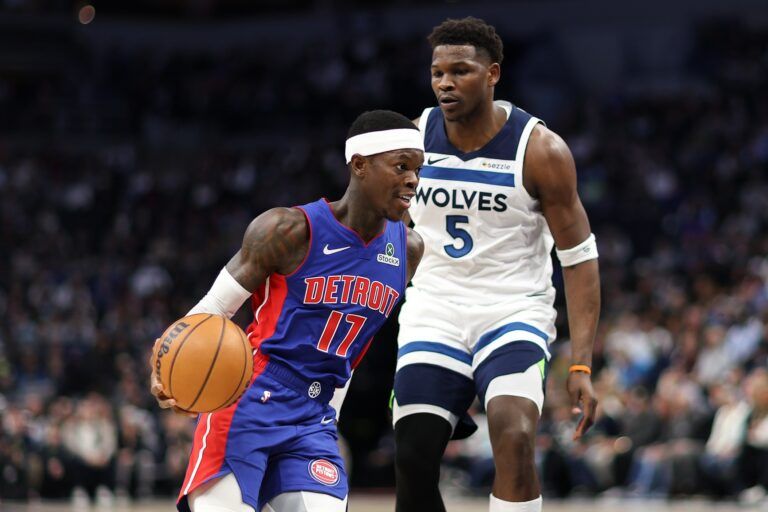Detroit Pistons guard Dennis Schroder (17) works around Minnesota Timberwolves guard Anthony Edwards (5) during the first quarter at Target Center.