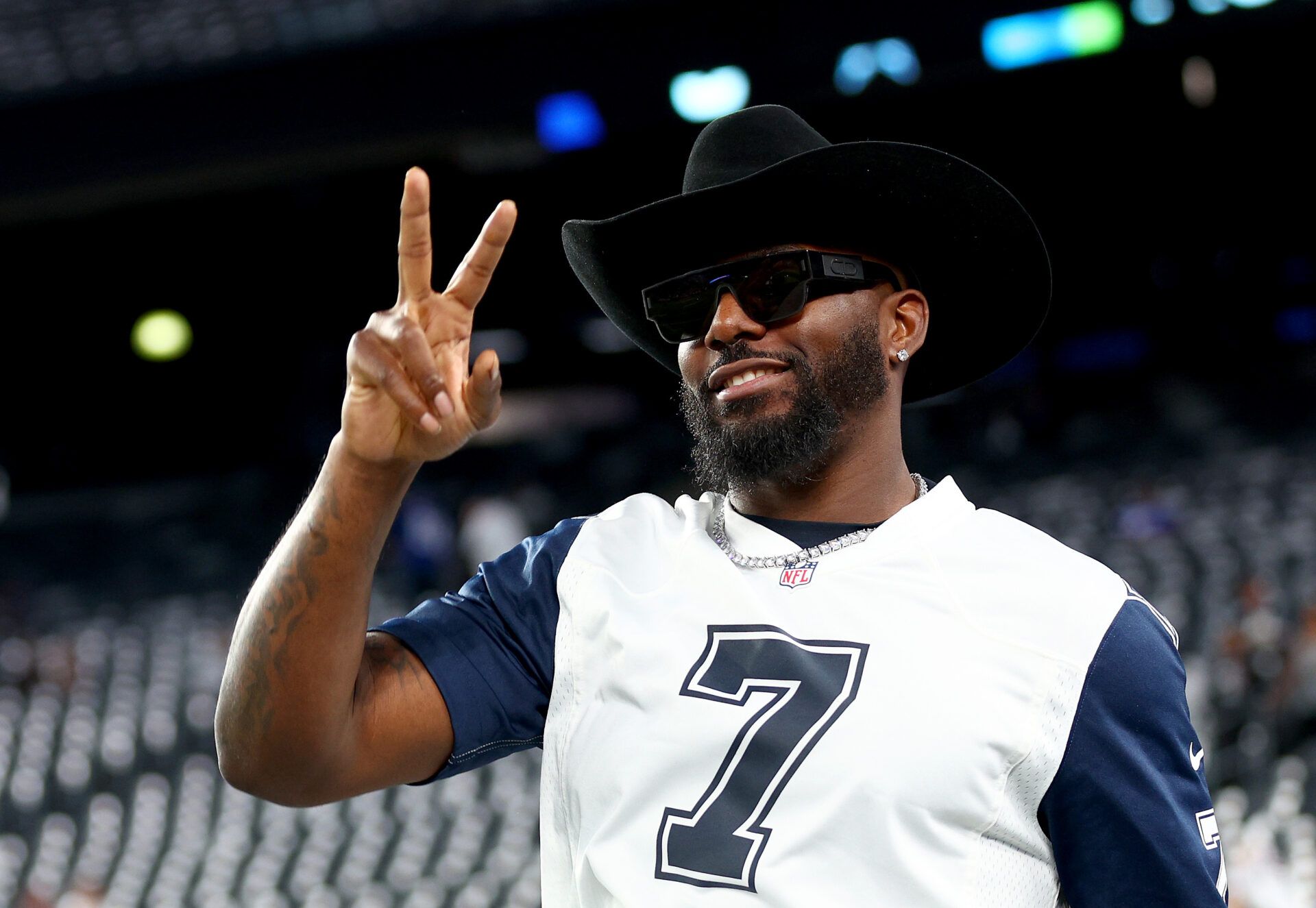 EAST RUTHERFORD, NEW JERSEY - SEPTEMBER 26: Former Dallas Cowboys wide receiver Dez Bryant walks on the field before the game between the New York Giants and the Dallas Cowboys at MetLife Stadium on September 26, 2022 in East Rutherford, New Jersey. (Photo by Elsa/Getty Images)