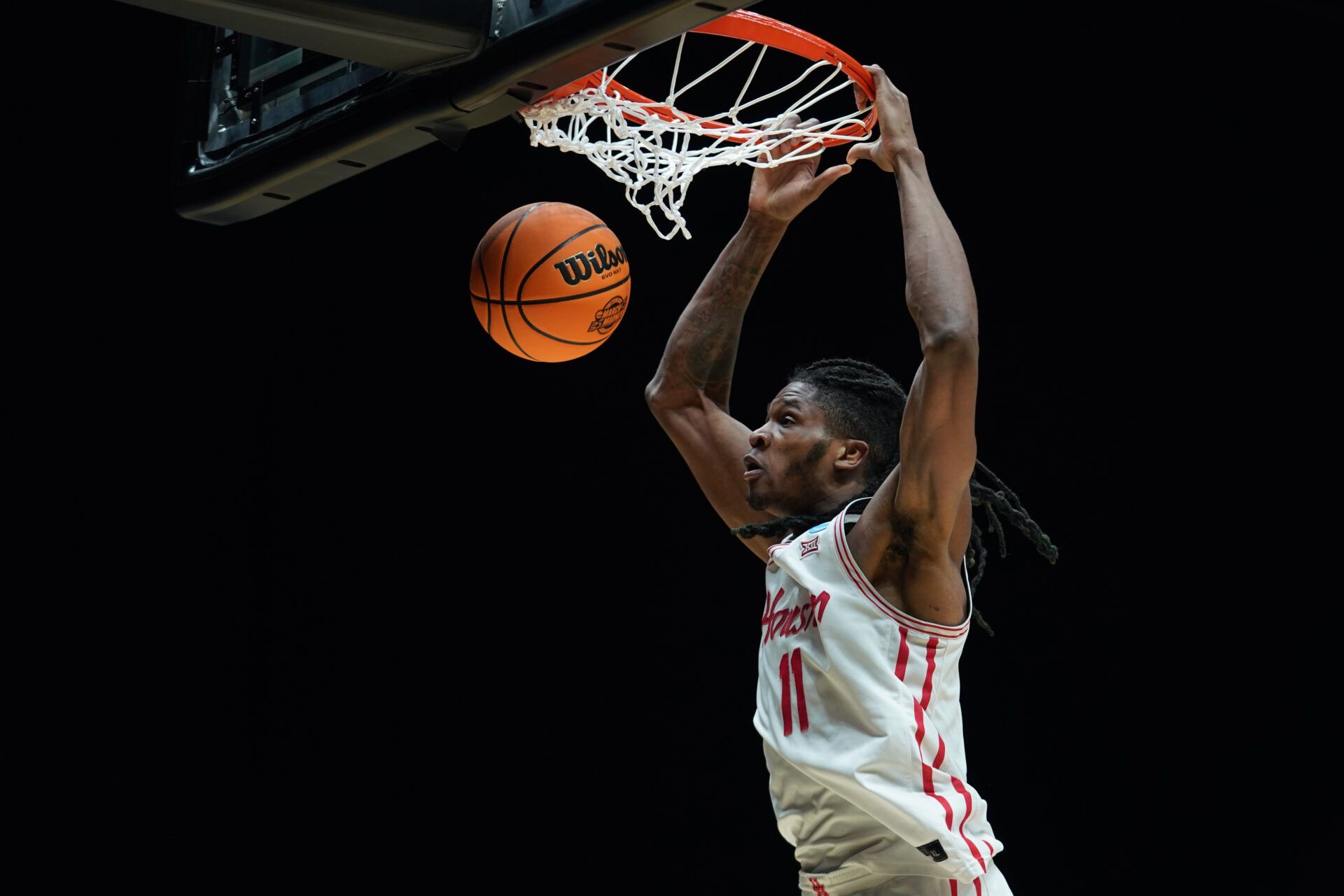 Mar 28, 2025; Indianapolis, IN, USA; Houston Cougars forward Joseph Tugler (11) dunks the ball against the Purdue Boilermakers in the second half during a Midwest Regional semifinal of the 2025 NCAA tournament at Lucas Oil Stadium. Mandatory Credit: Robert Goddin-Imagn Images