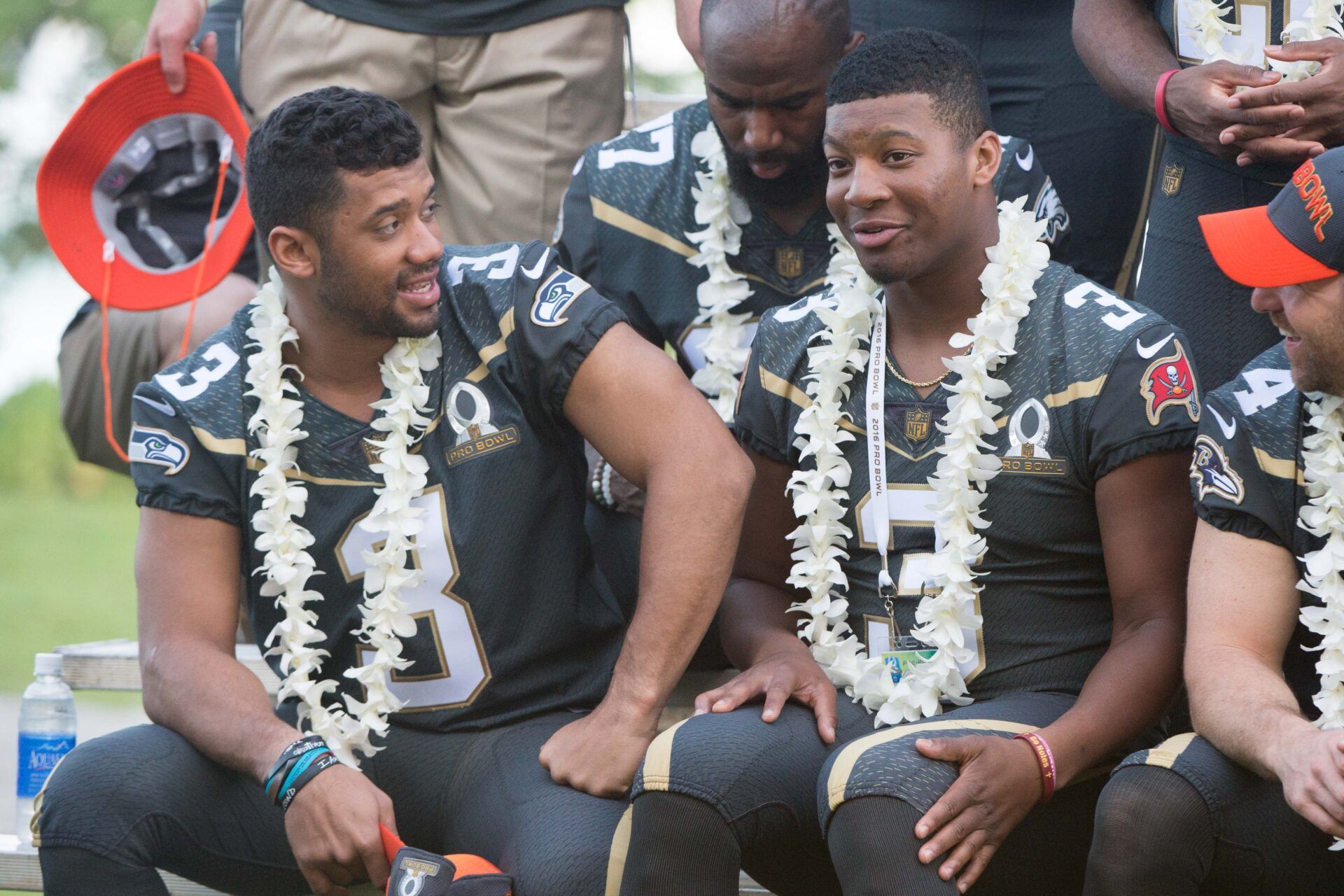 January 29, 2016; Kahuku, HI, USA; Team Irvin quarterback Russell Wilson of the Seattle Seahawks (3, left) talks to Team Irvin quarterback Jameis Winston of the Tampa Bay Buccaneers (3, right) during 2016 Pro Bowl photo day at Turtle Bay Resort. Mandatory Credit: Kyle Terada-USA TODAY Sports