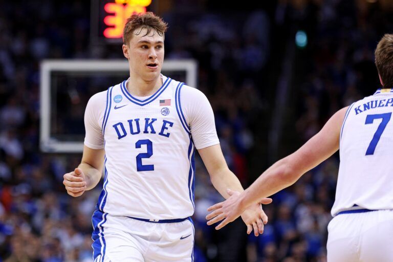 Duke Blue Devils forward Cooper Flagg (2) celebrates with guard Kon Knueppel (7) during the second half against the Alabama Crimson Tide in the East Regional final of the 2025 NCAA tournament at Prudential Center.