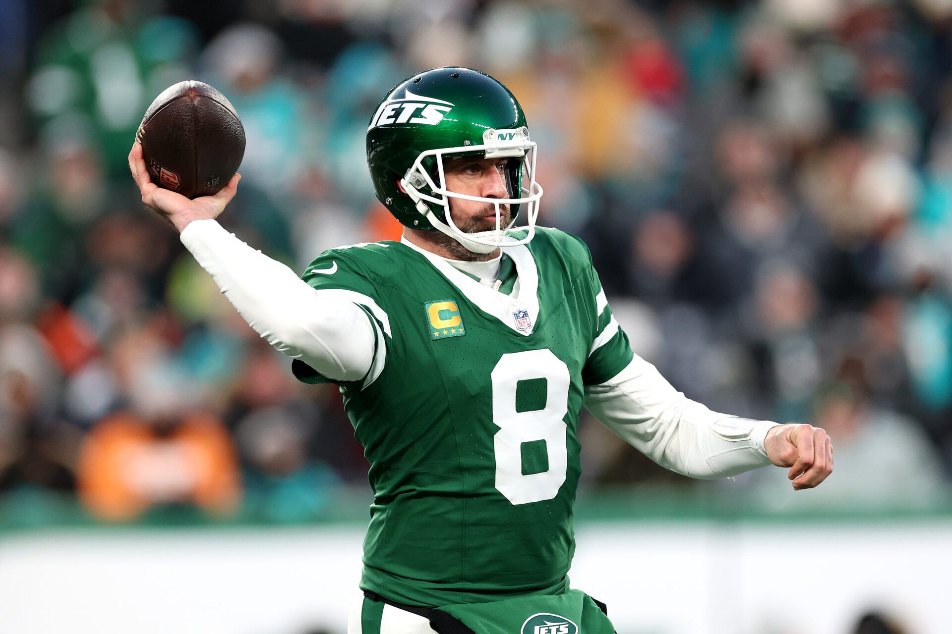 EAST RUTHERFORD, NEW JERSEY - JANUARY 05: Aaron Rodgers #8 of the New York Jets in action against the Miami Dolphins at MetLife Stadium on January 05, 2025 in East Rutherford, New Jersey. (Photo by Luke Hales/Getty Images)