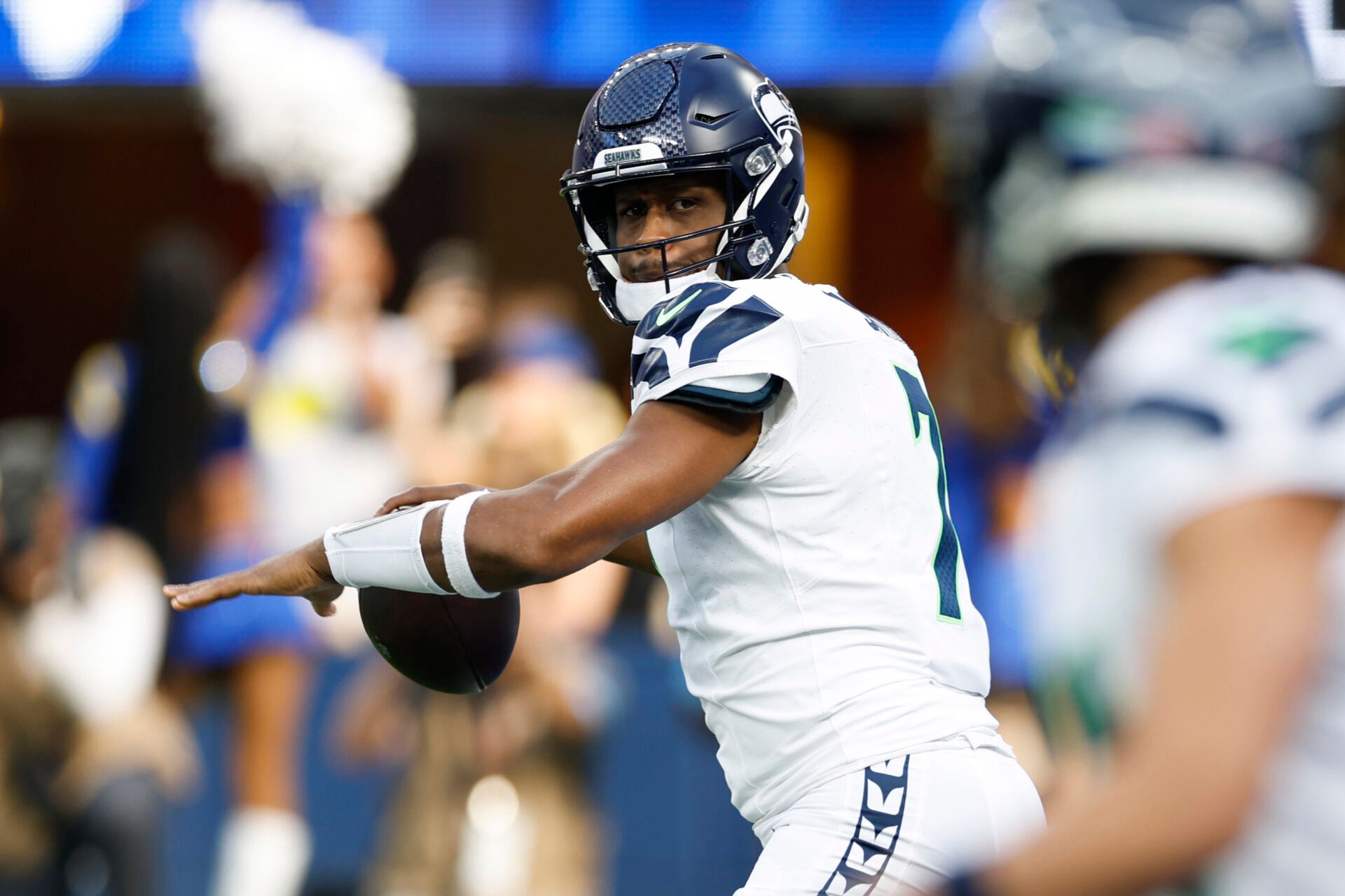 INGLEWOOD, CALIFORNIA - JANUARY 05: Geno Smith #7 of the Seattle Seahawks throws a pass against the Los Angeles Rams during the first quarter at SoFi Stadium on January 05, 2025 in Inglewood, California. (Photo by Ronald Martinez/Getty Images)
