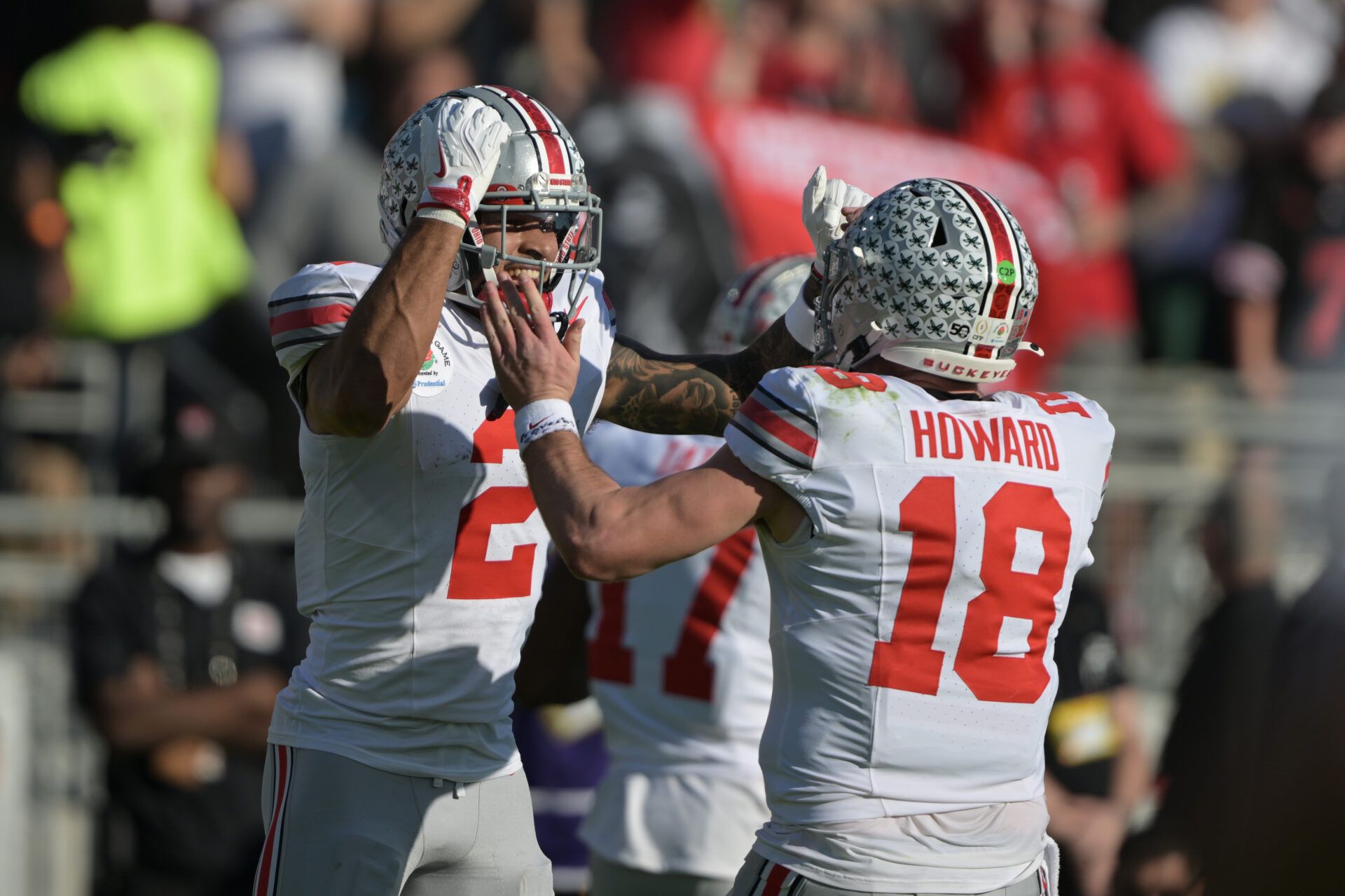 Jan 1, 2025; Pasadena, CA, USA; Ohio State Buckeyes wide receiver Emeka Egbuka (2) celebrates with quarterback Will Howard (18) after scoring a touchdown against the Oregon Ducks in the first quarter during the 2025 Rose Bowl college football quarterfinal game at Rose Bowl Stadium. Mandatory Credit: Jayne Kamin-Oncea-Imagn Images