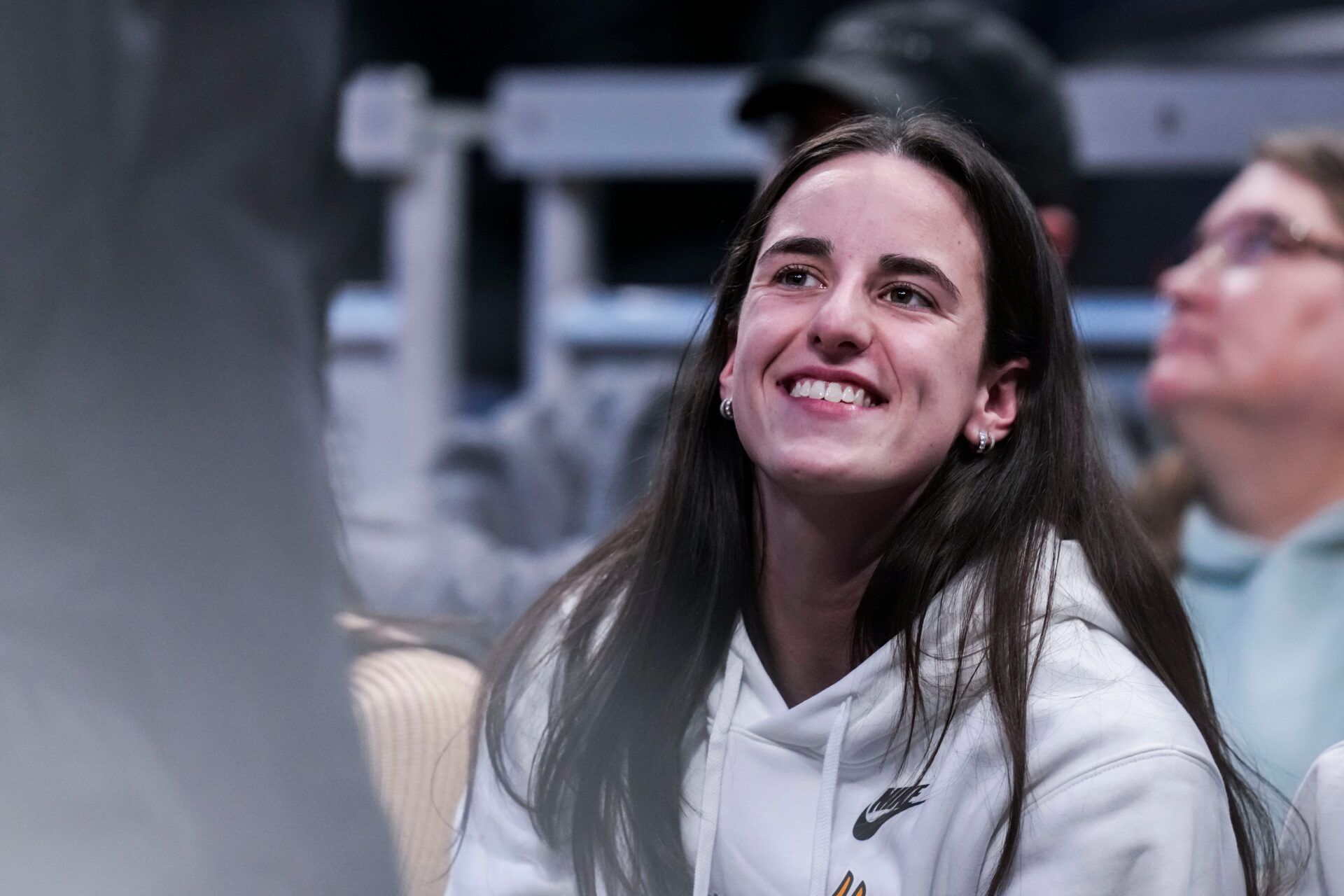 Indiana Fever guard Caitlin Clark (22) smiles Thursday, March 6, 2025, in a round two game at the 2025 TIAA Big Ten Women's Basketball Tournament between the Iowa Hawkeyes and the Michigan State Spartans at Gainbridge Fieldhouse in Indianapolis.