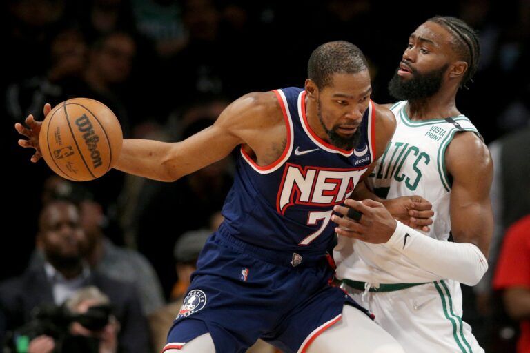 Brooklyn Nets forward Kevin Durant (7) controls the ball against Boston Celtics guard Jaylen Brown (7) during the fourth quarter of game four of the first round of the 2022 NBA playoffs at Barclays Center.
