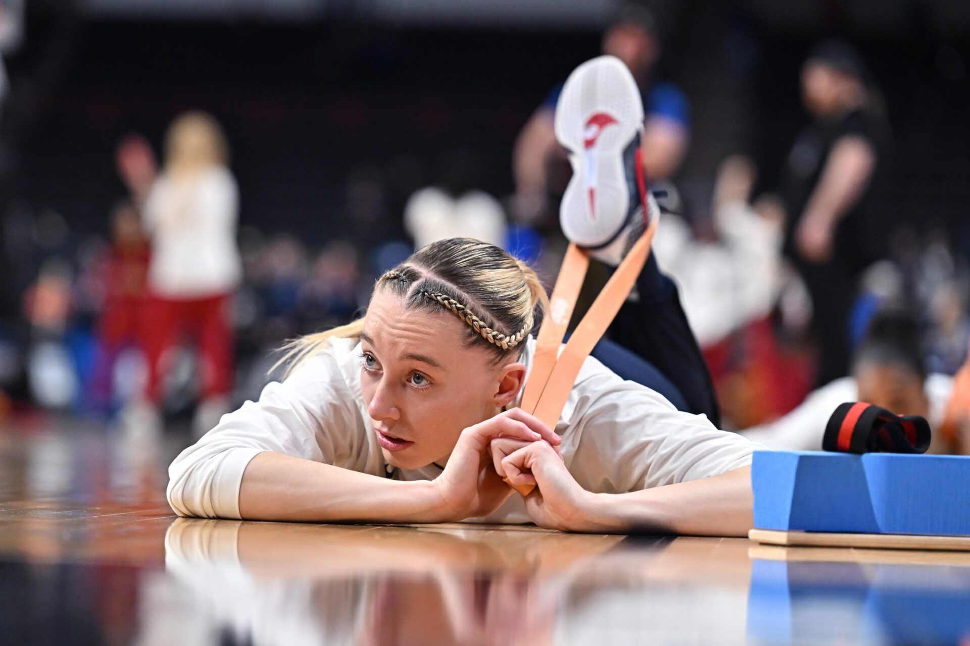 UConn Huskies guard Paige Bueckers (5) stretches before a Elite 8 NCAA Tournament basketball game against the USC Trojans at Spokane Arena.
