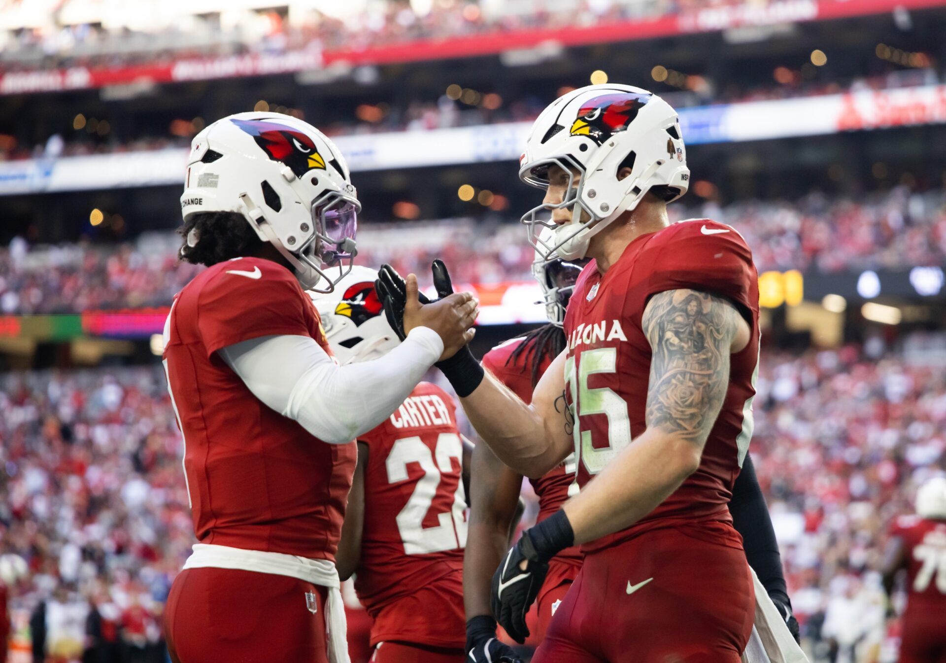 Arizona Cardinals quarterback Kyler Murray (1) celebrates a touchdown with tight end Trey McBride (85) against the San Francisco 49ers at State Farm Stadium.