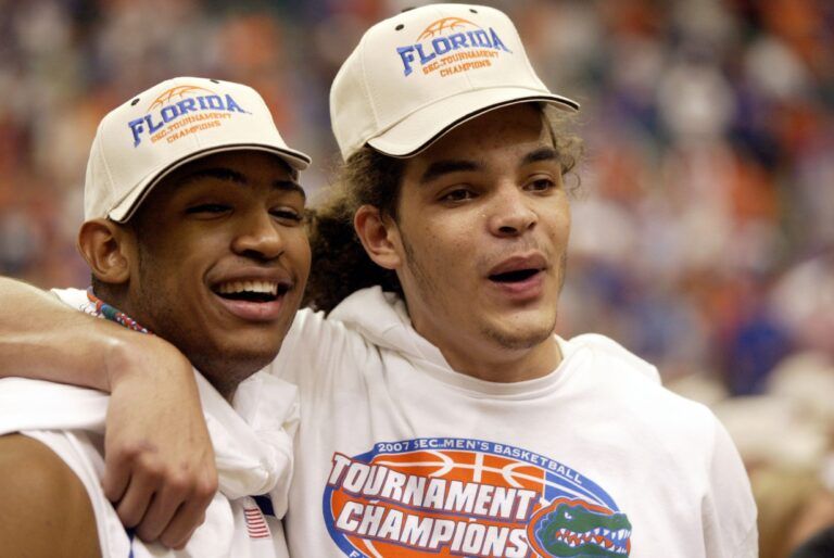 Florida Gators forward Joakim Noah (right) celebrates with forward Al Horford after the Gators defeated the Arkansas Razorbacks 77-56 to win the SEC Tournament championship game at the Georgia Dome in Atlanta, GA.