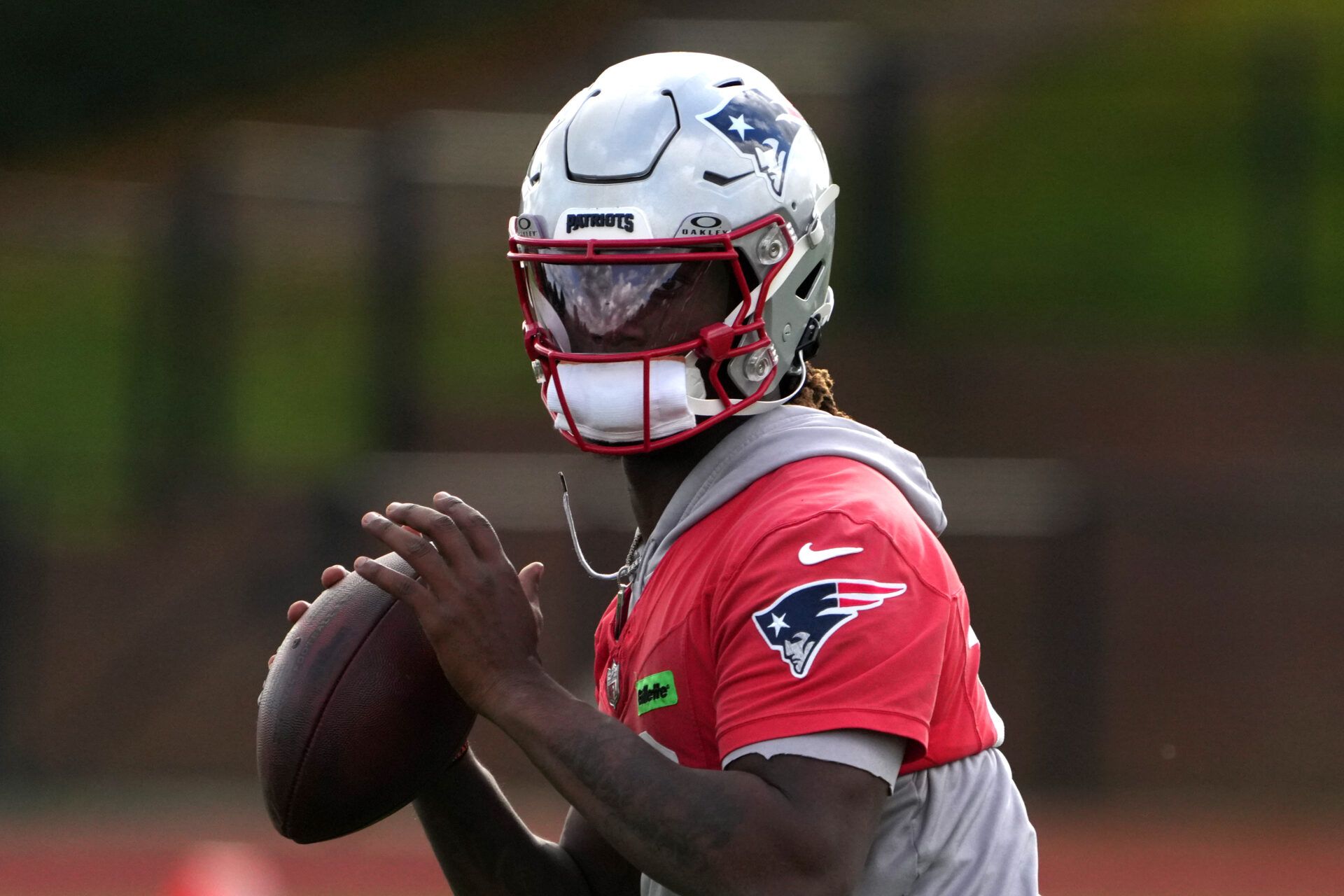 Oct 18, 2024; London, United Kingdom; New England Patriots quarterback Joe Milton III (19) throws the ball during practice at the Harrow School. Mandatory Credit: Kirby Lee-Imagn Images