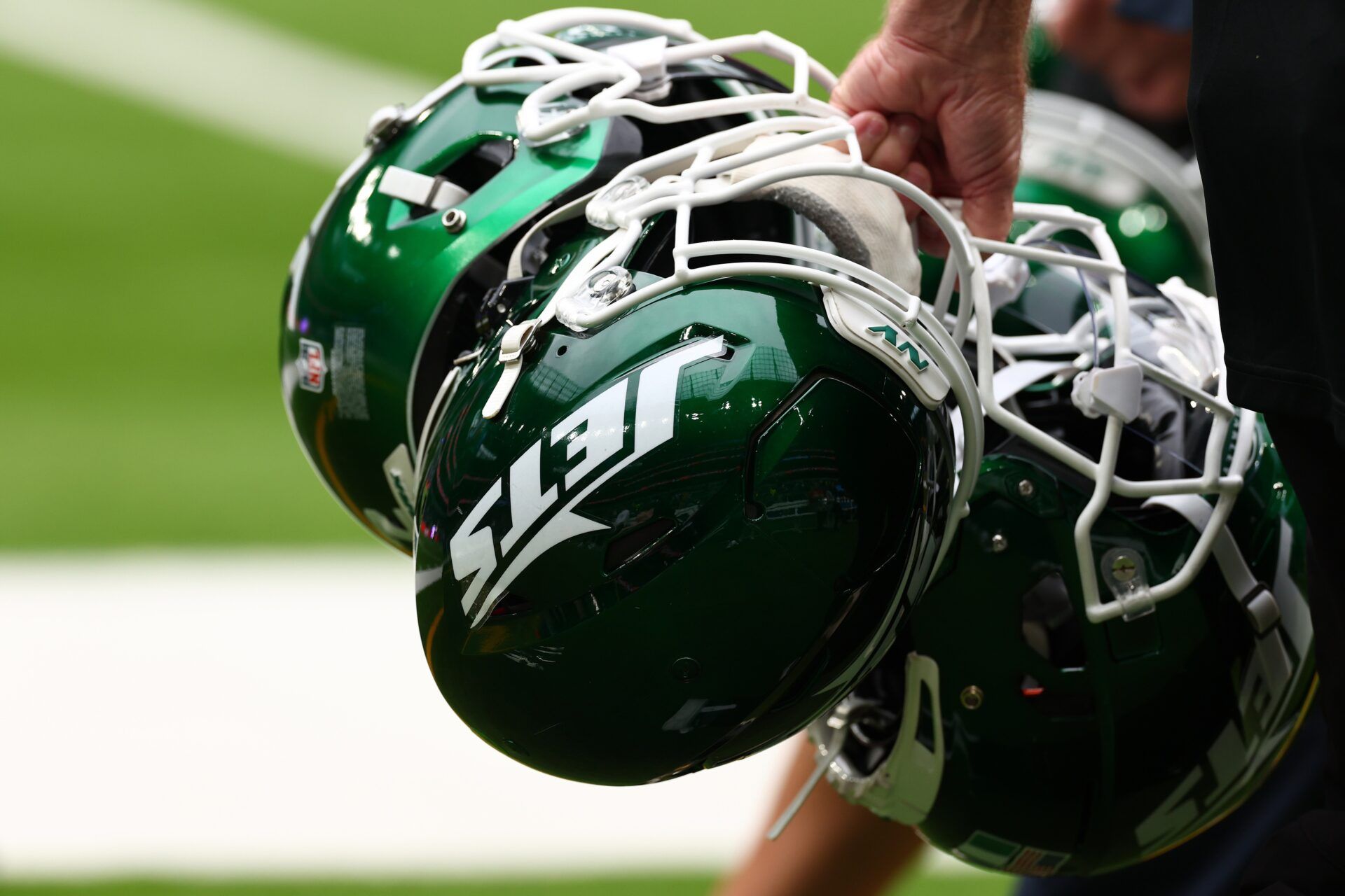 New York Jets helmets are held by staff before the match against Minnesota Vikings at Tottenham Hotspur Stadium.