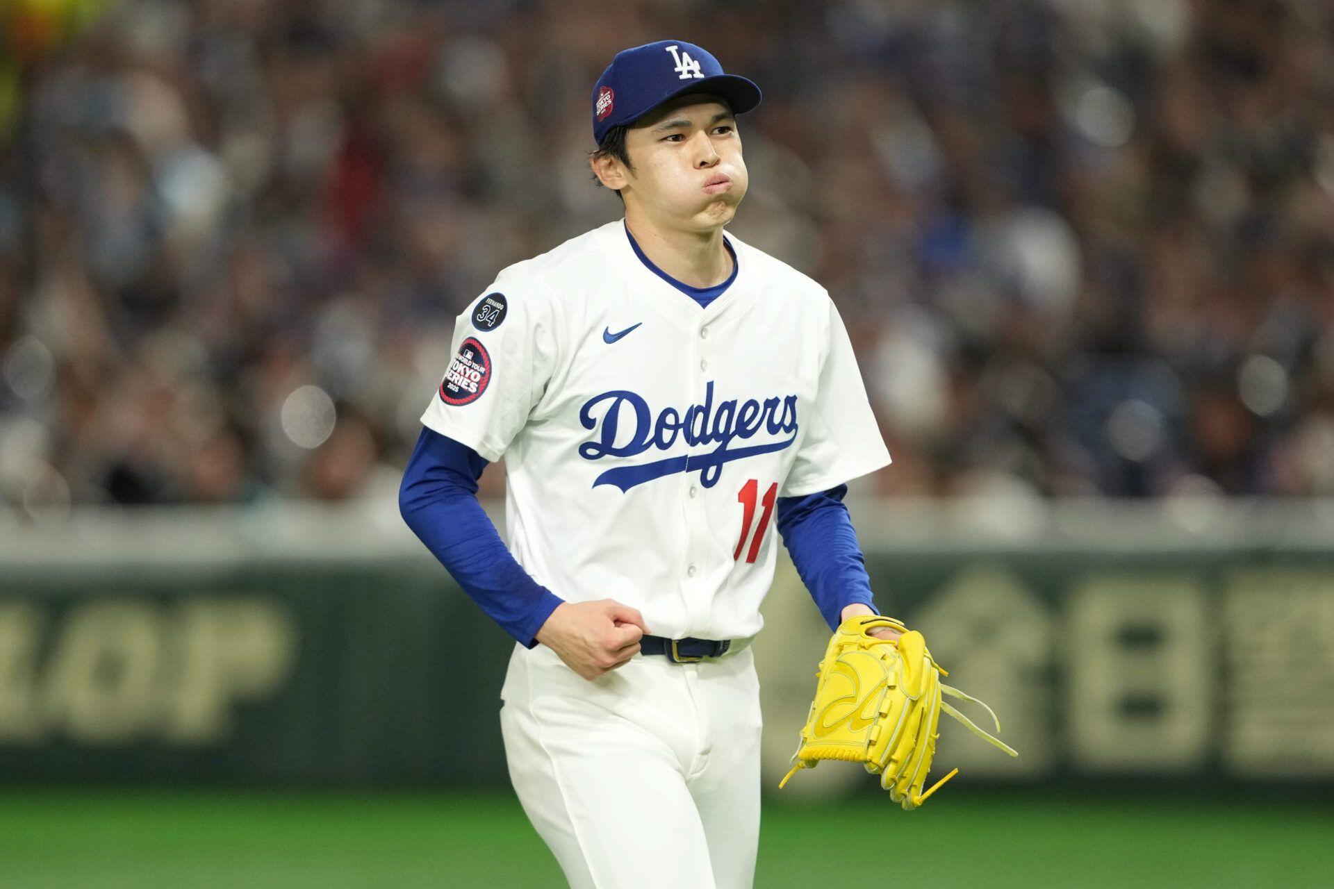 Los Angeles Dodgers starting pitcher Roki Sasaki (11) reacts after the third inning against the Chicago Cubs during the Tokyo Series at Tokyo Dome.