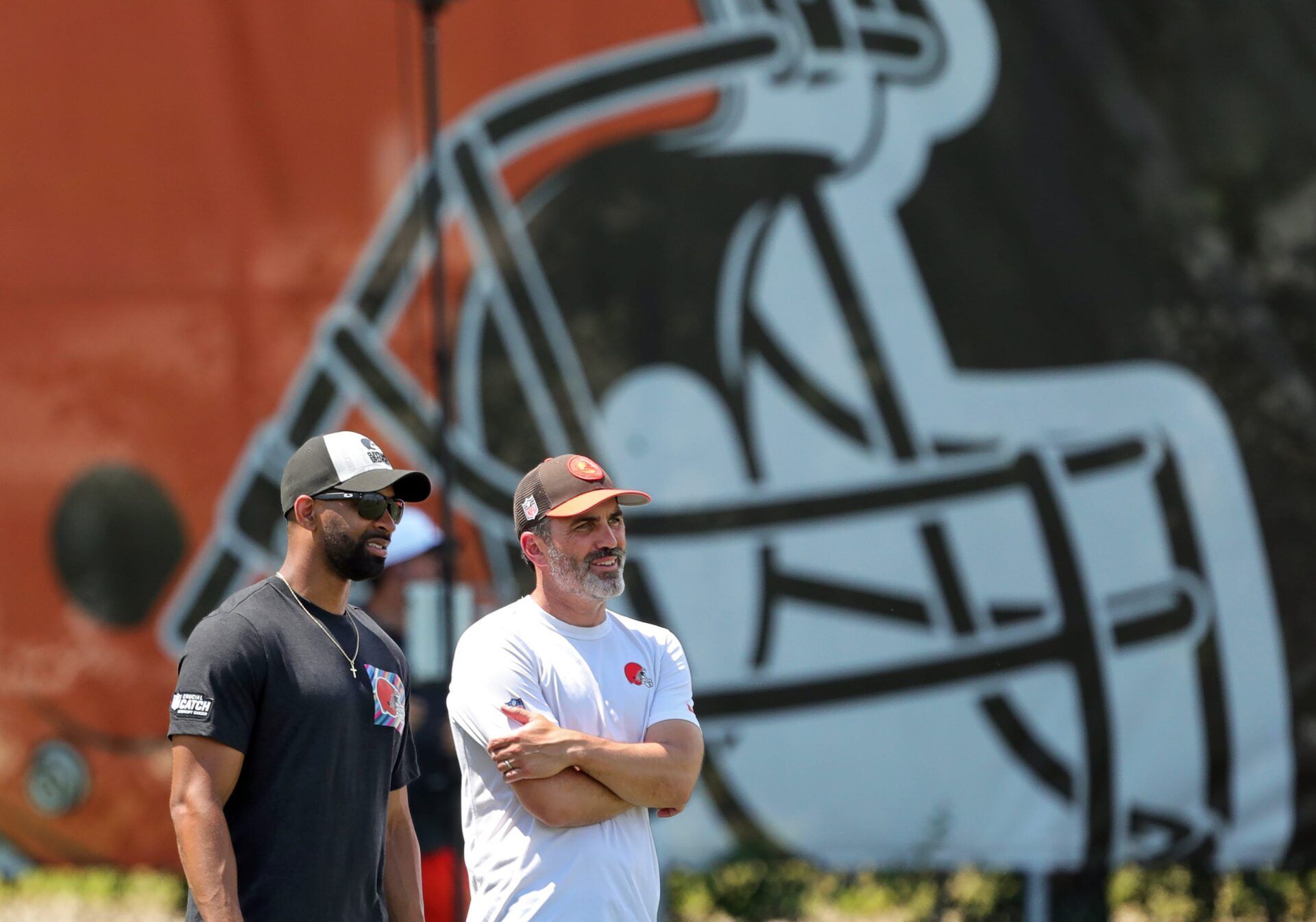 Browns general manager Andrew Berry, left, and head coach Kevin Stefanski watch practice during minicamp, Thursday, June 13, 2024, in Berea.