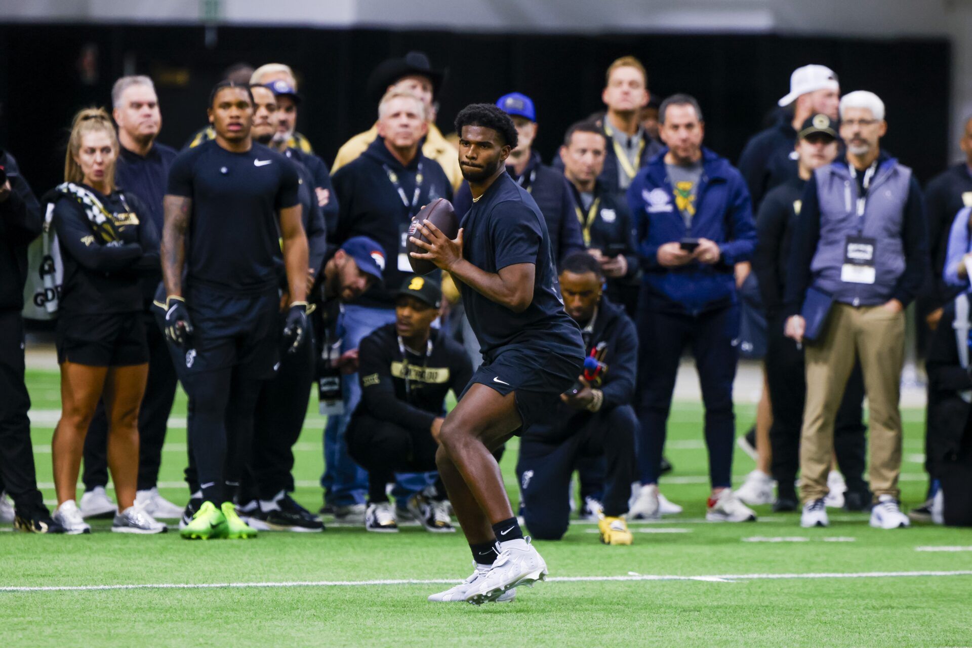 Colorado Buffaloes quarterback Shedeur Sanders (2) looks to make a pass at the University of Colorado NFL Showcase at the CU Indoor Practice Facility.