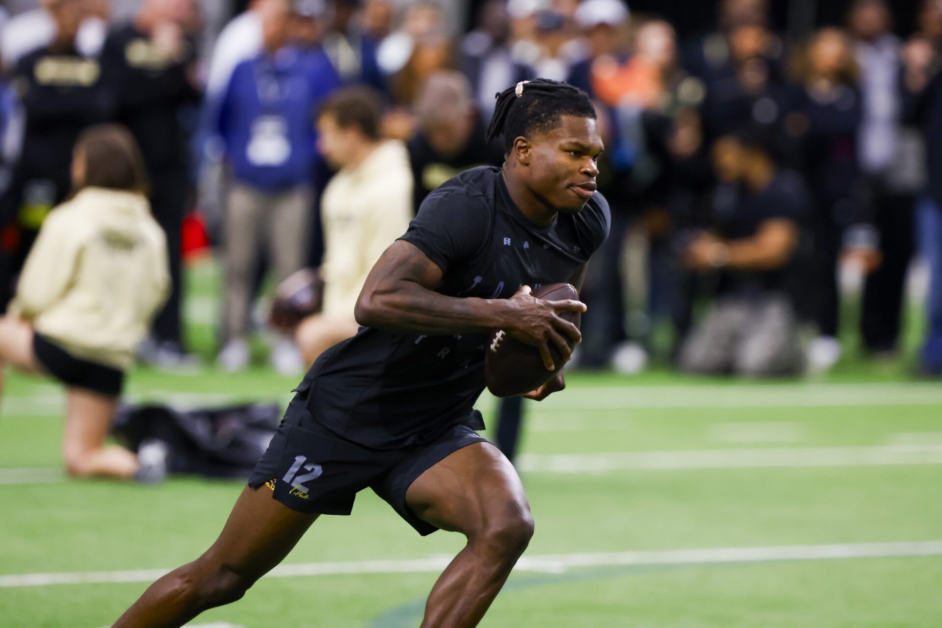 Colorado Buffaloes wide receiver Travis Hunter (12) runs drills at the University of Colorado NFL Showcase at the CU Indoor Practice Facility.