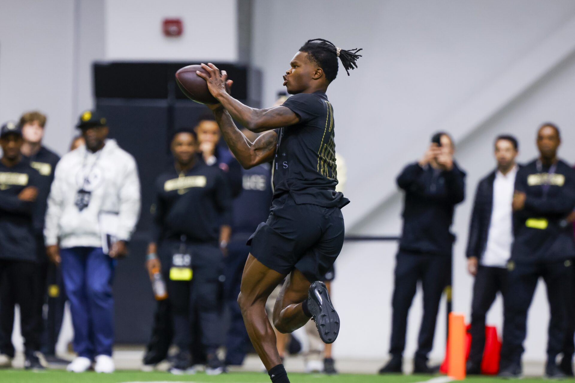 Colorado Buffaloes wide receiver Travis Hunter (12) makes a catch at the University of Colorado NFL Showcase at the CU Indoor Practice Facility.